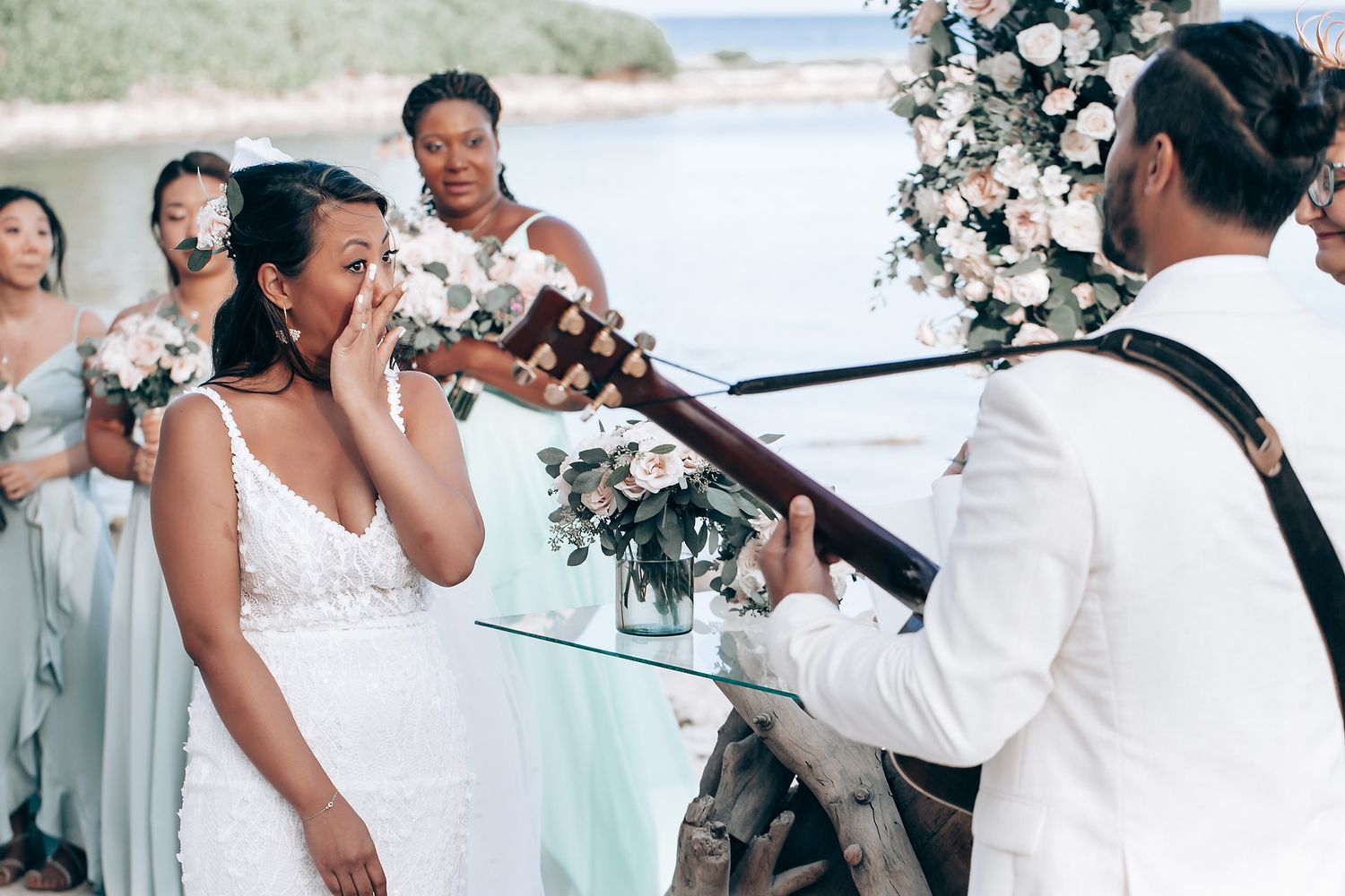 A romantic beachside wedding ceremony with a surprise musical performance.