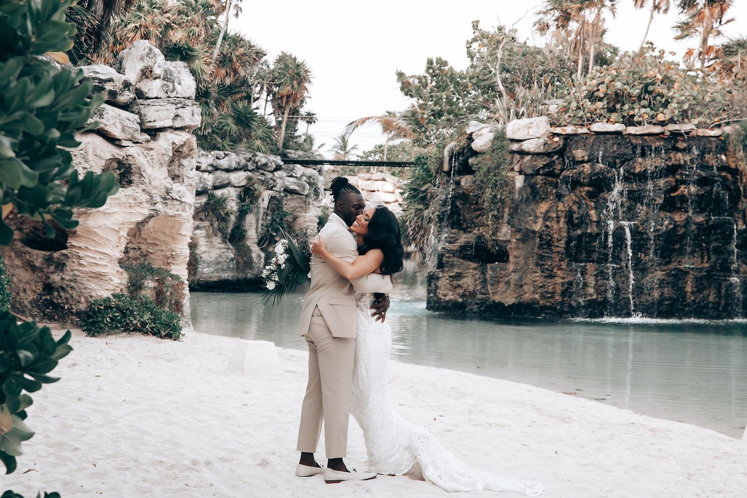 Scenic waterfall backdrop for outdoor wedding ceremony in natural setting.