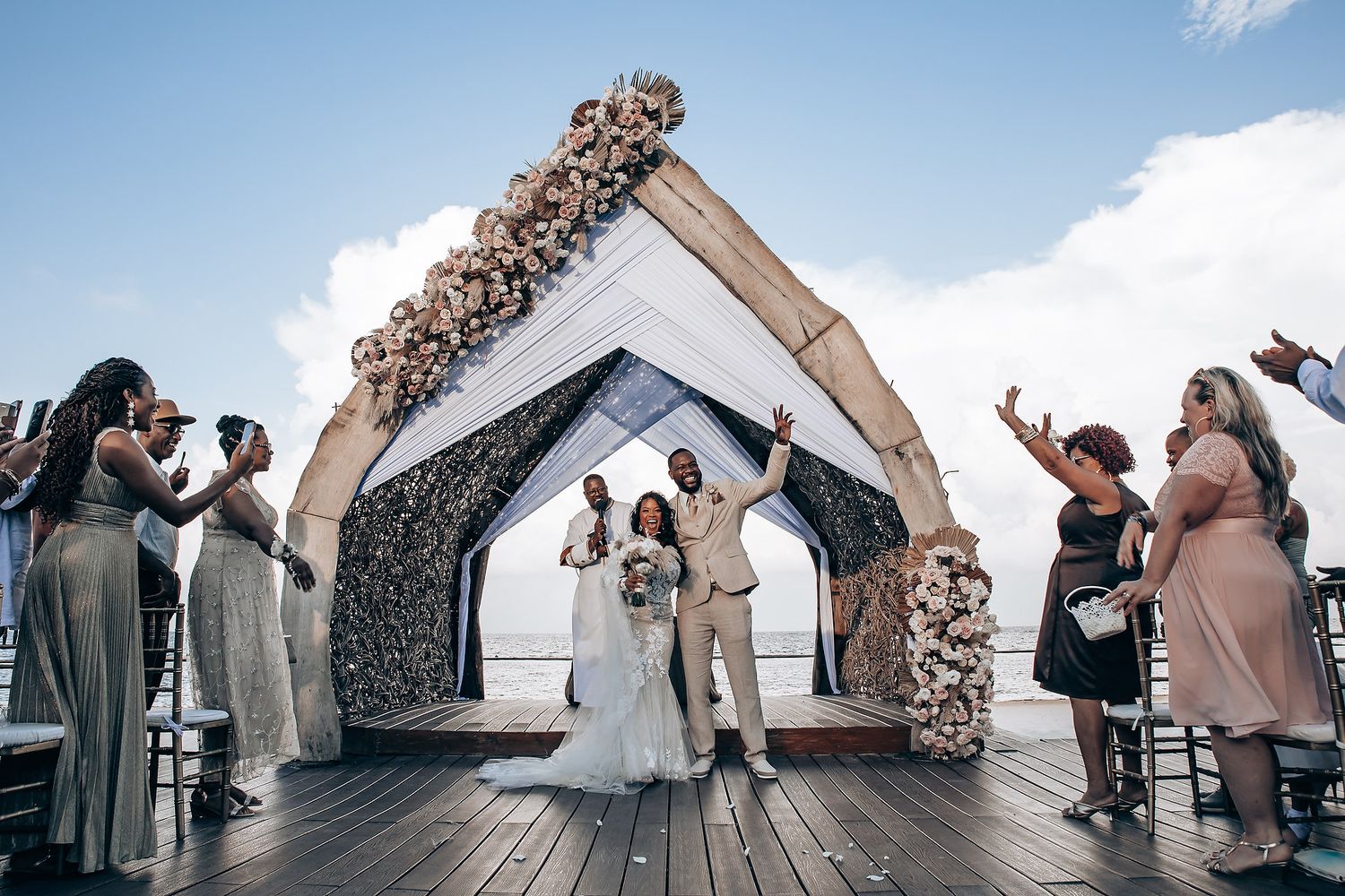 Wide-angle shots of wedding ceremony moments on a waterfront deck.
