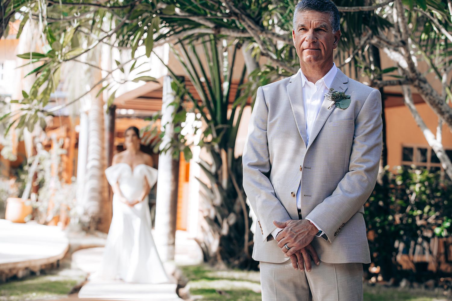 A series of wedding photos showing a couple in a tropical setting with palm trees and elegant attire.