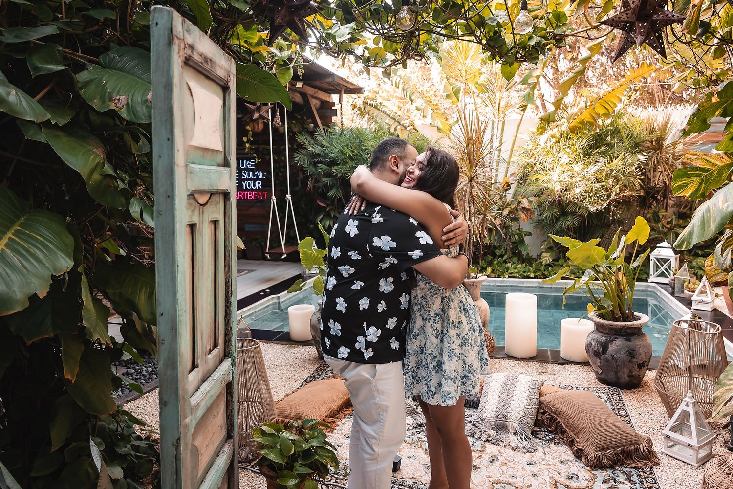 A romantic garden proposal sequence with tropical plants in the background.
