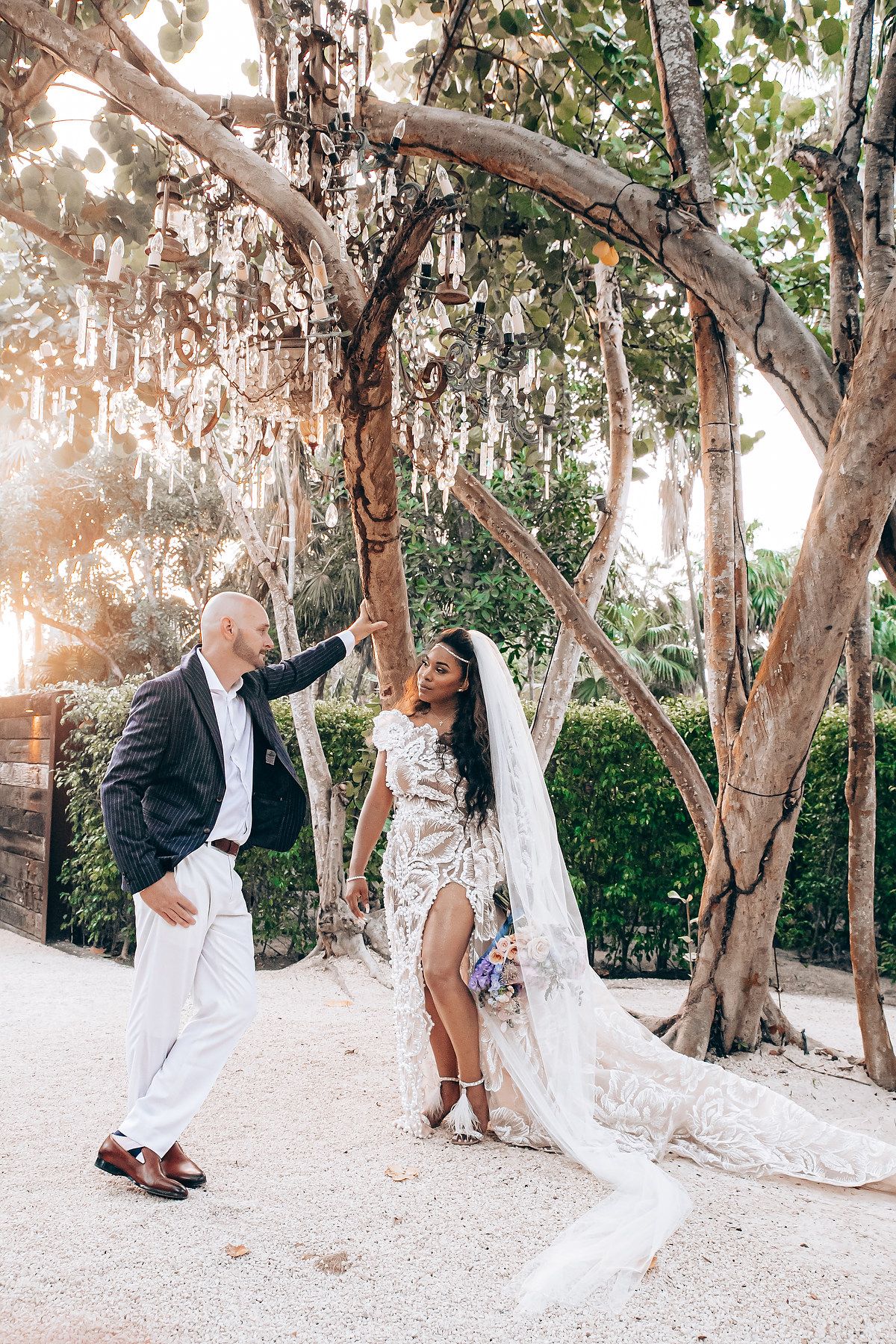 Romantic wedding moments captured in a sunlit outdoor garden setting.