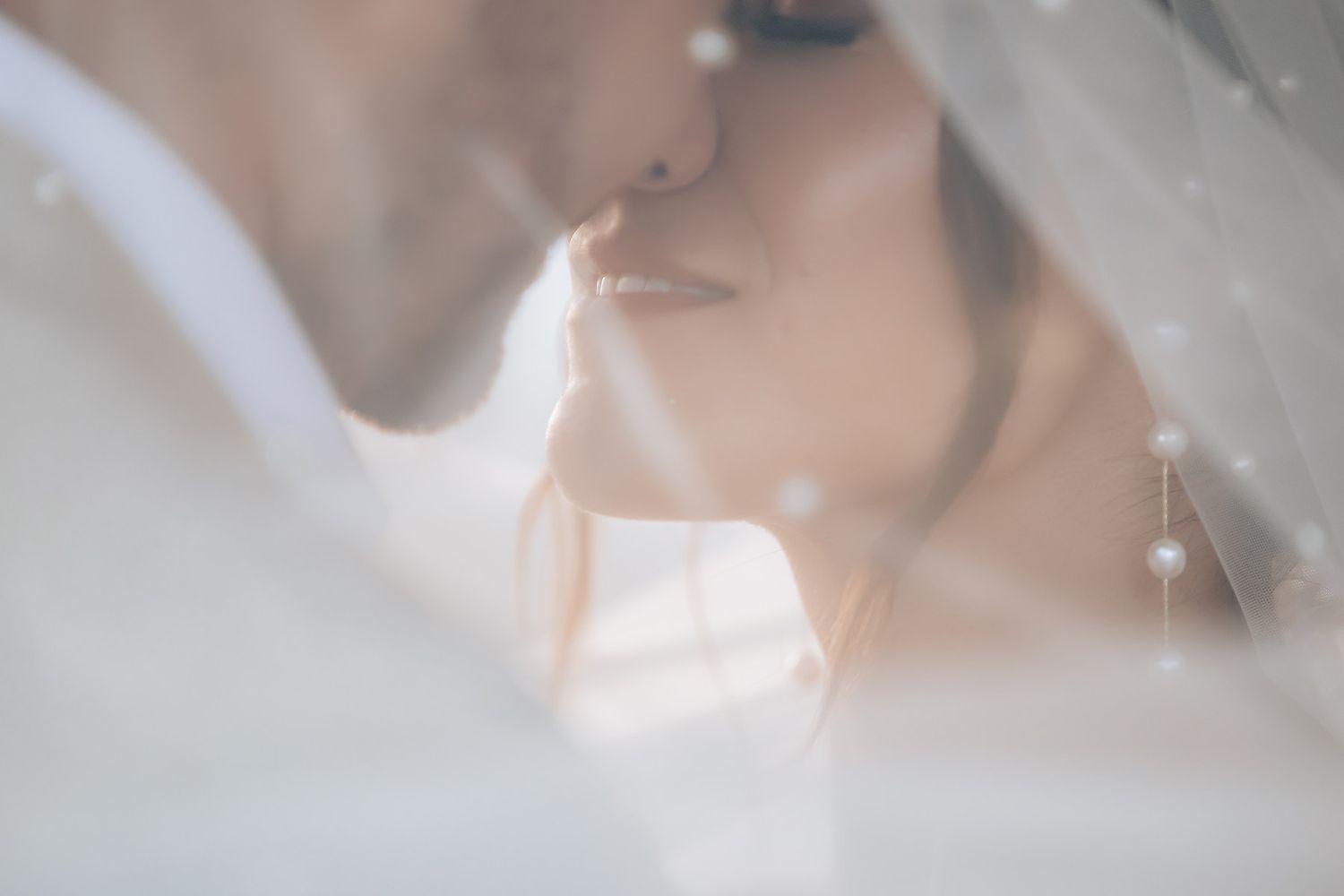Soft focus close-up shot capturing romantic wedding moment details.