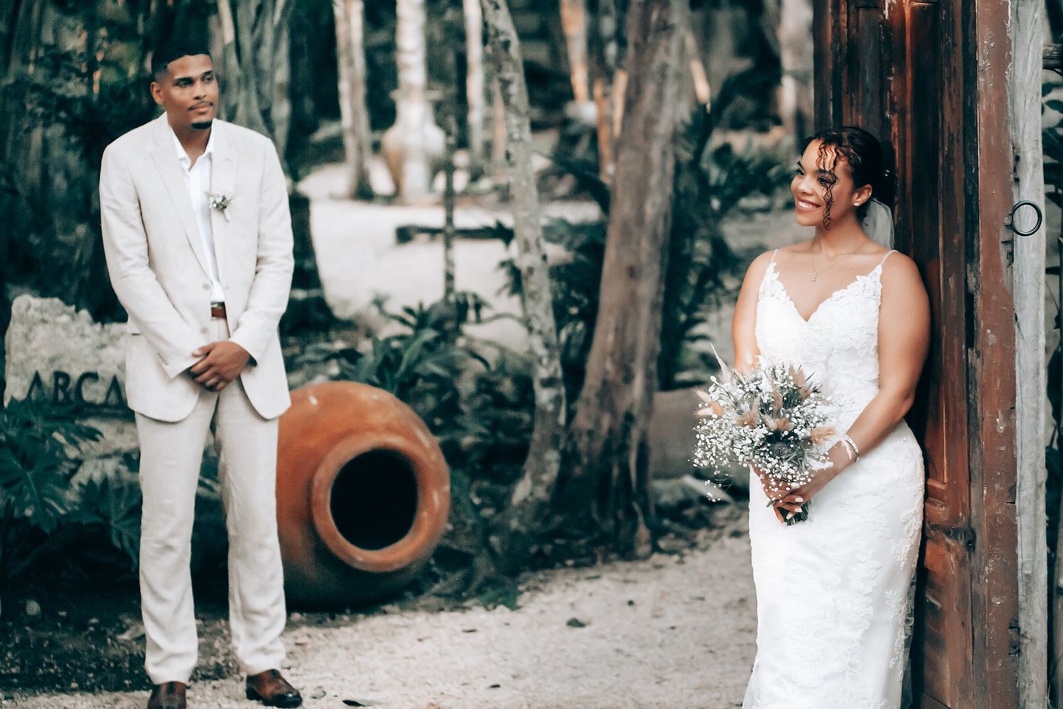 Rustic outdoor wedding celebration with natural woodland elements.