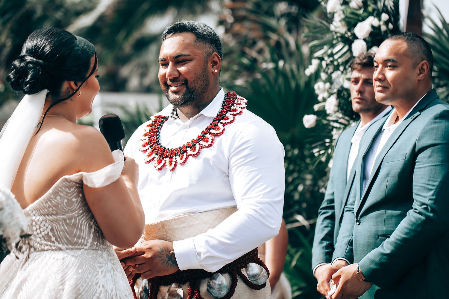 Wedding ceremony moments captured at a tropical beach location.