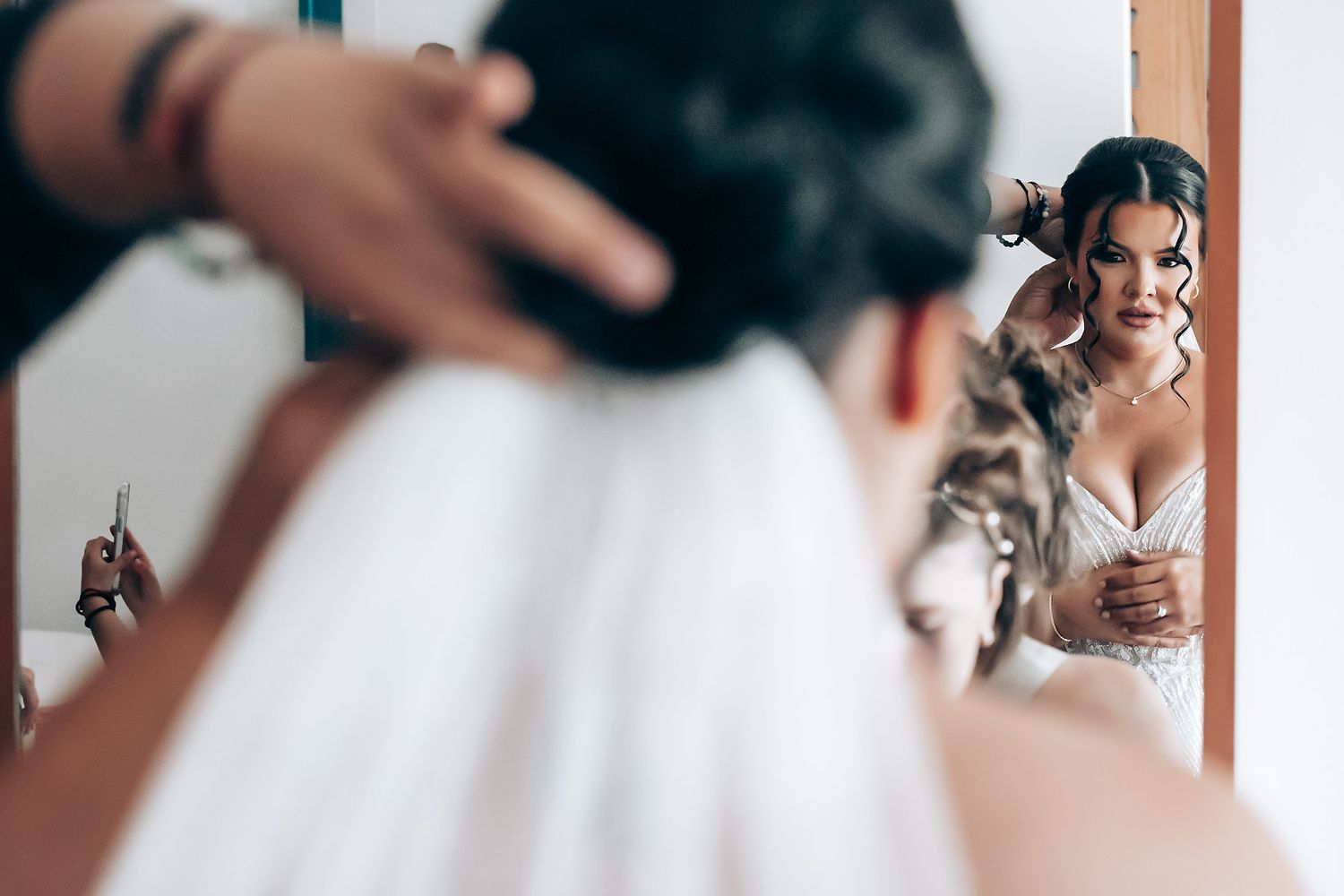 Getting ready moments captured in a series of candid wedding day photographs.