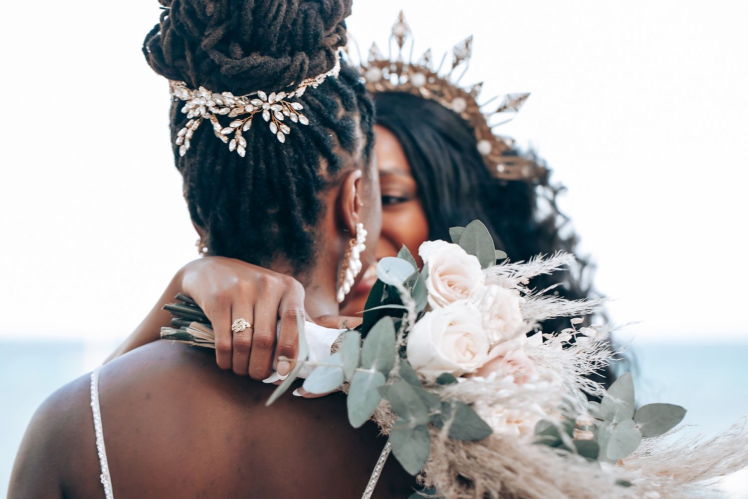Artistic wedding photography with soft focus and ethereal white details.