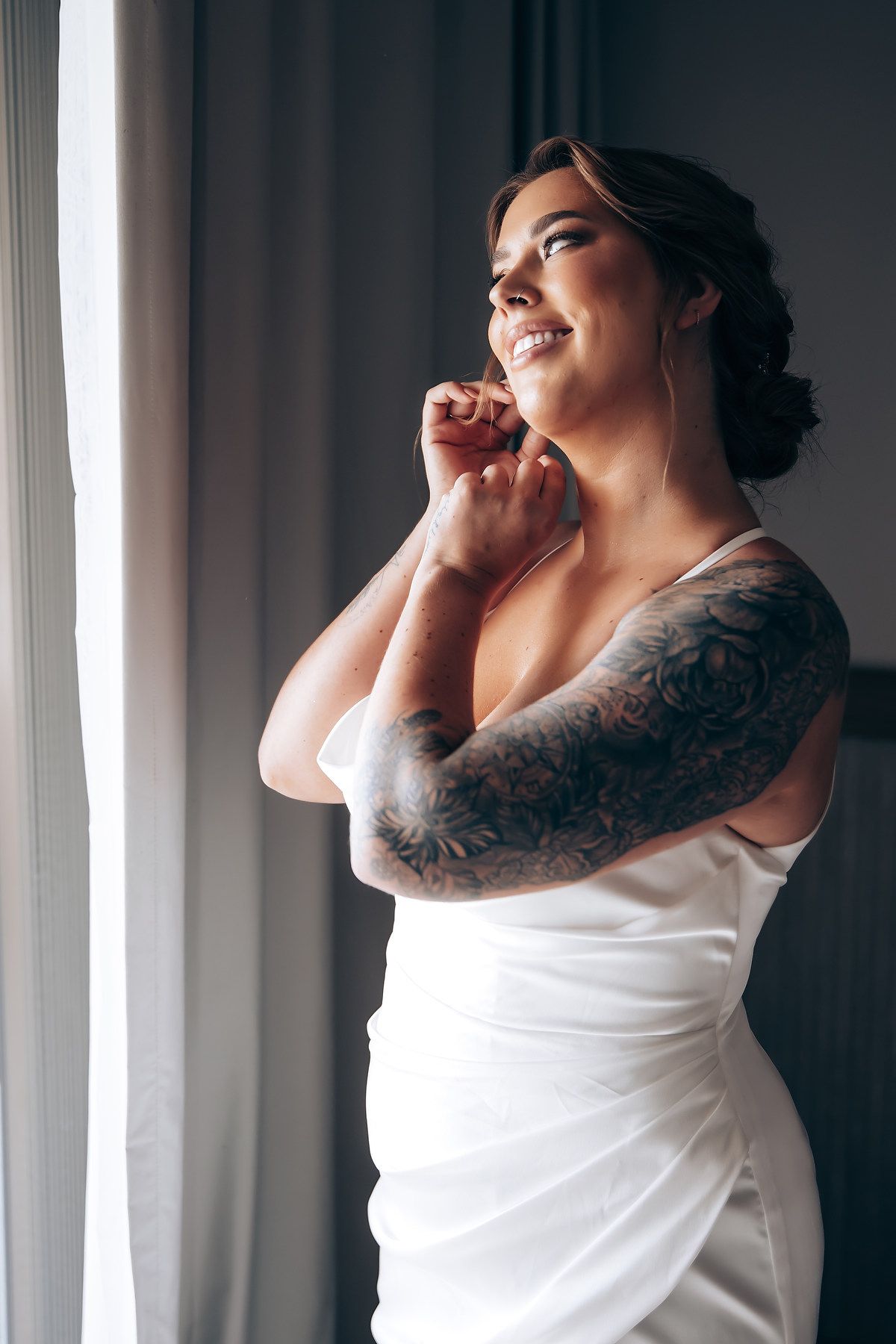 A person in a white sleeveless top poses dramatically against window light in a triptych-style photo series.