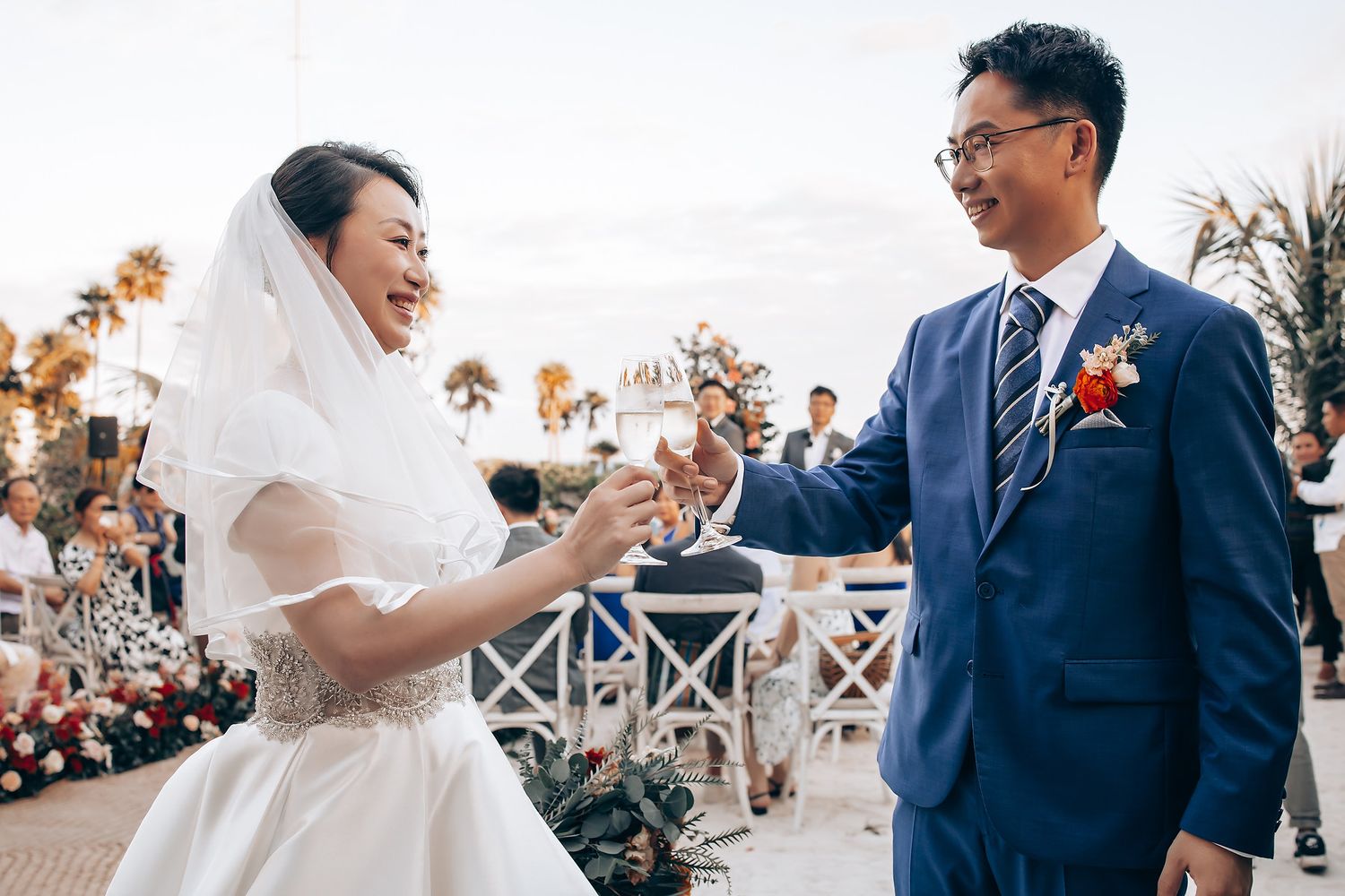 Romantic wedding ceremony sequence with white and coral floral arrangements.