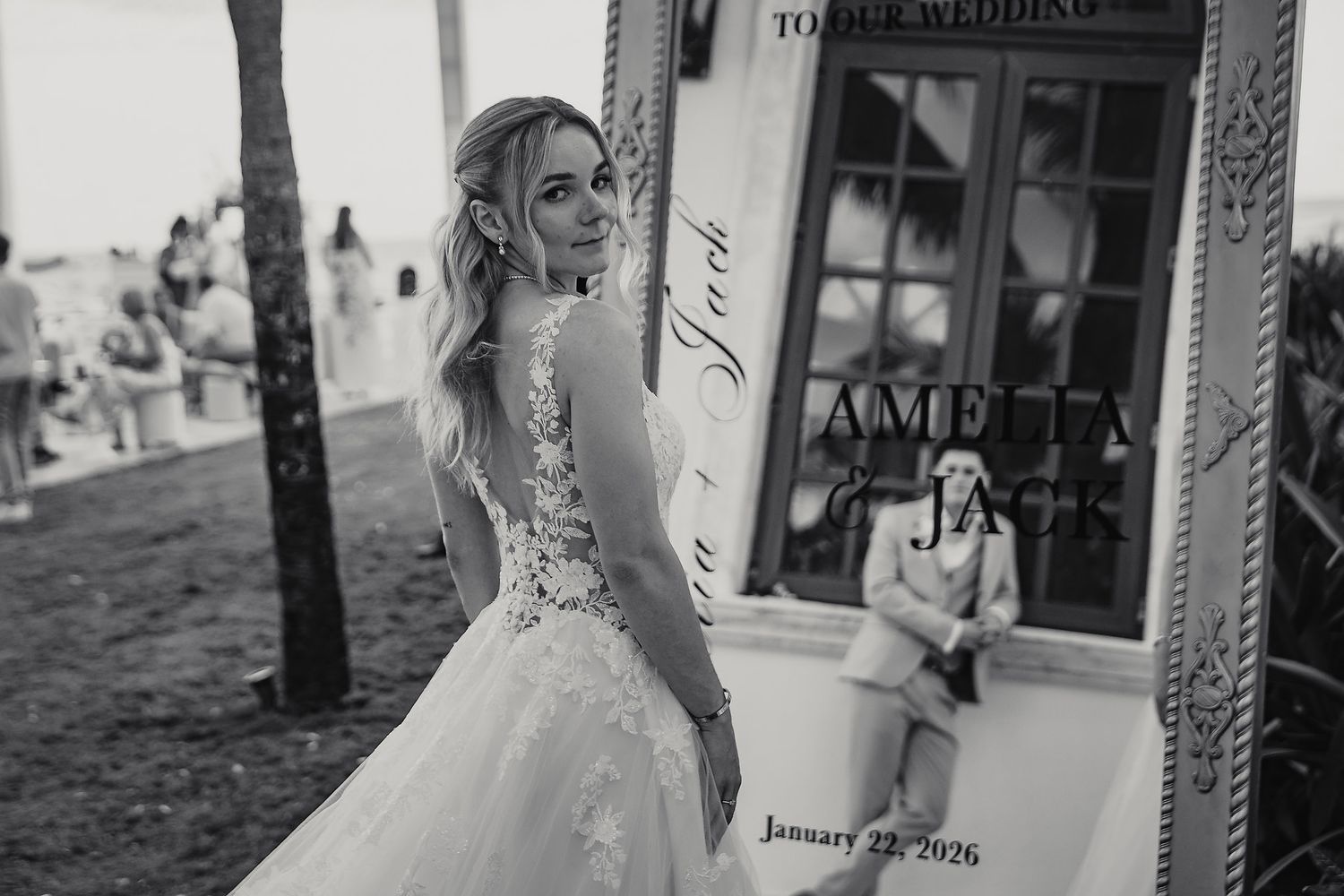 Wedding photo session at a tropical beach resort with palm trees.