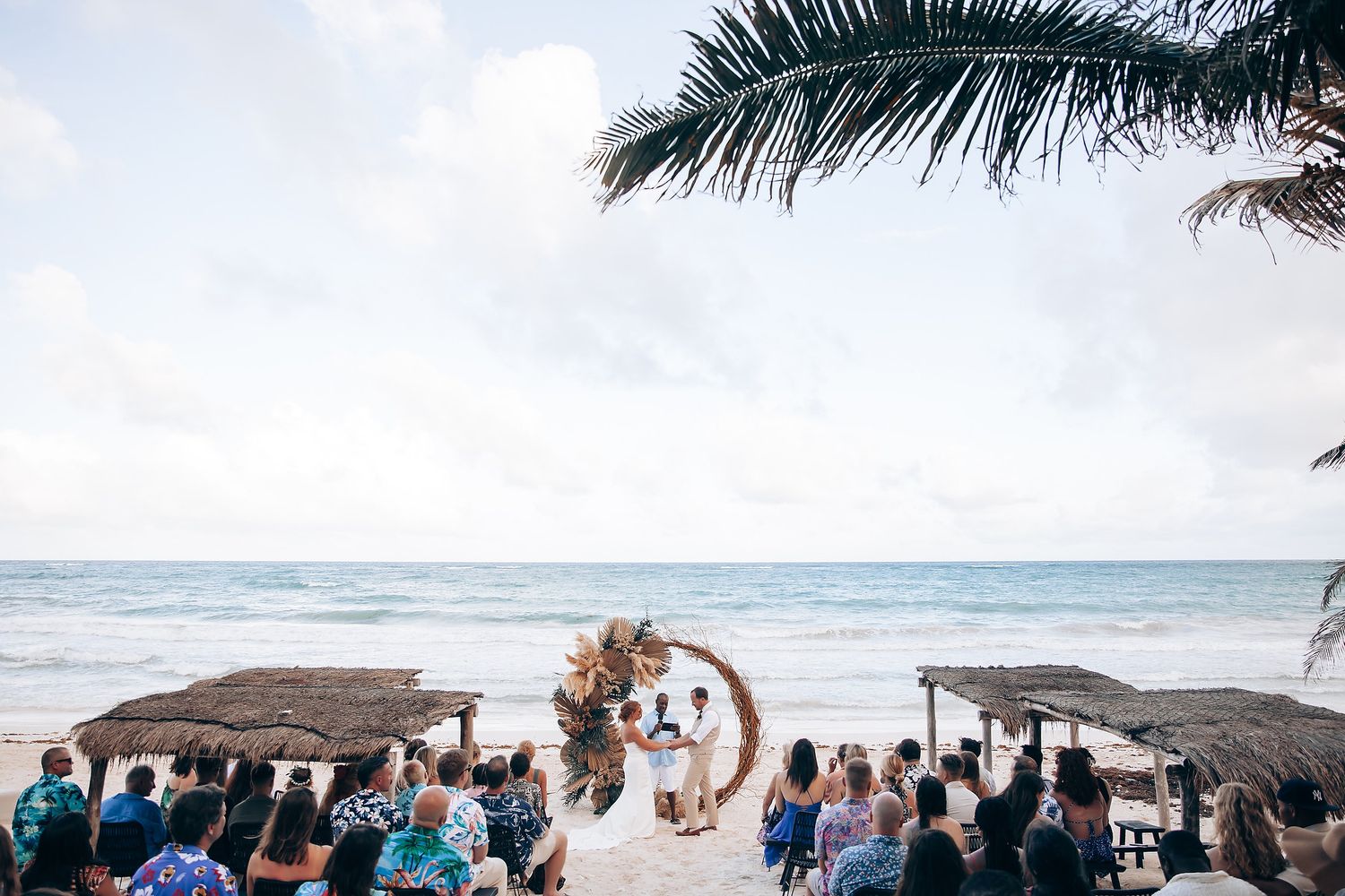 Beachfront wedding ceremony at NEST Tulum boutique hotel