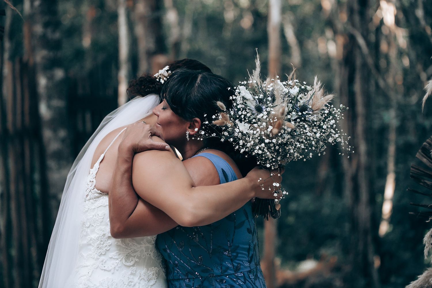 Sweet wedding moments captured in a forest setting.