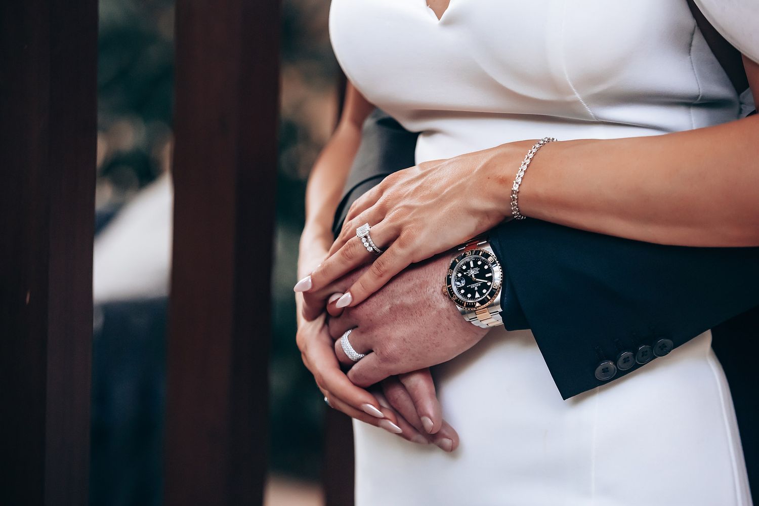 Close-up shots of wedding rings and hands with elegant jewelry.