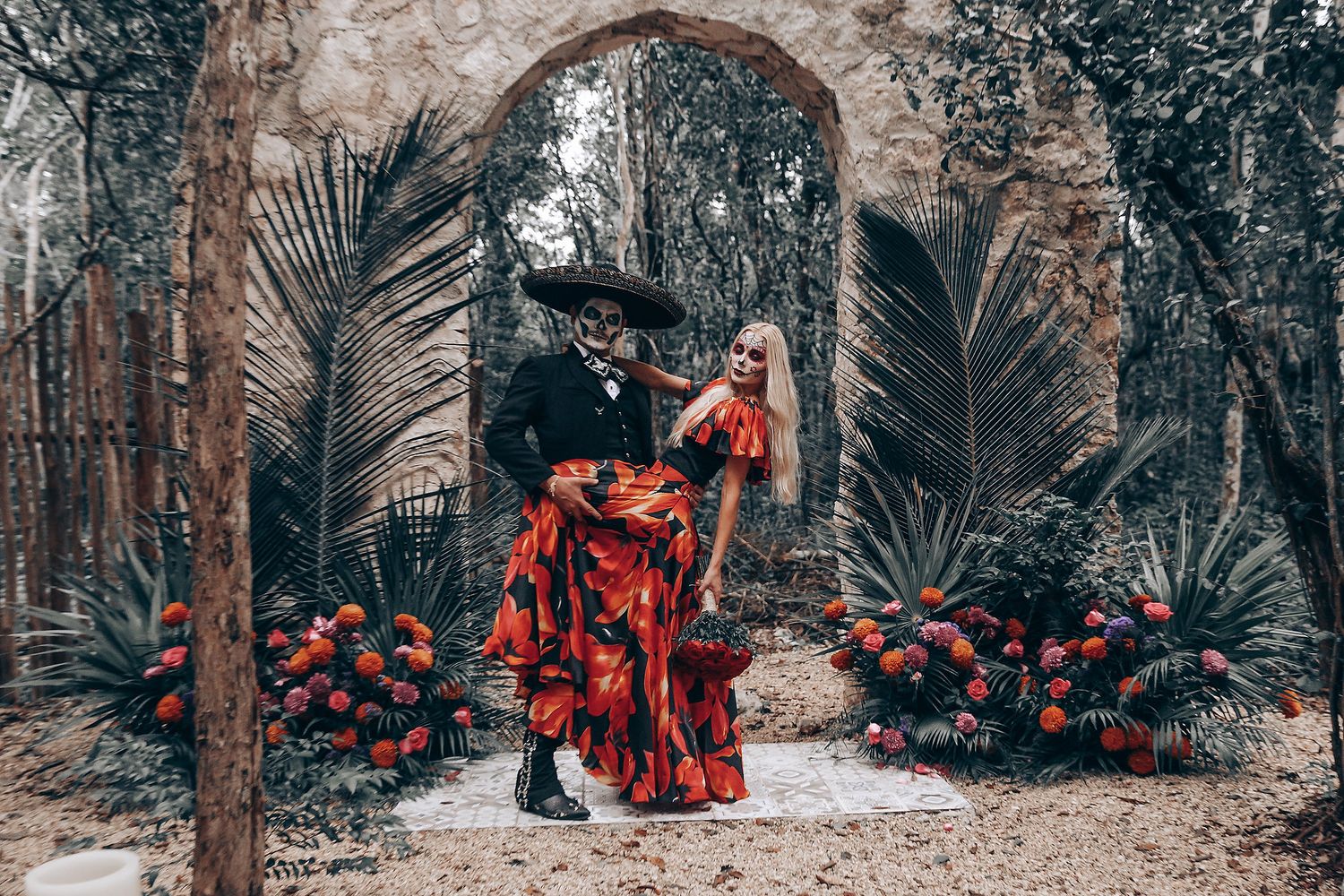 Dark romantic scene with stone archways and tropical plants in a gothic-inspired setting.