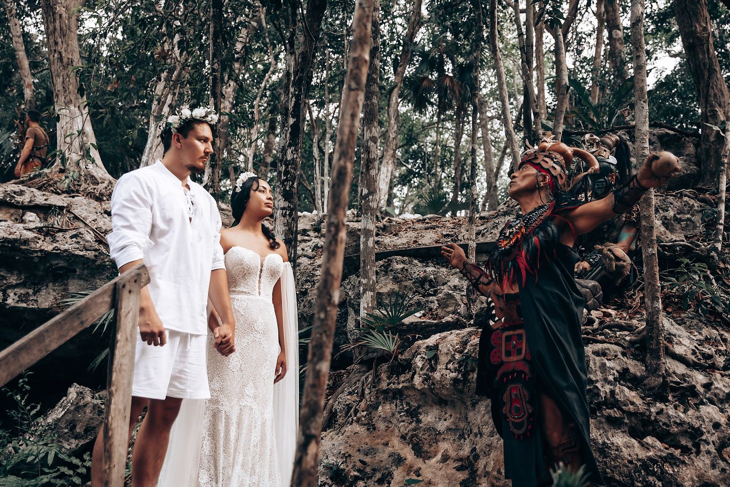 A series of romantic wedding photos showing couples in white attire posing together in a wooded outdoor setting.