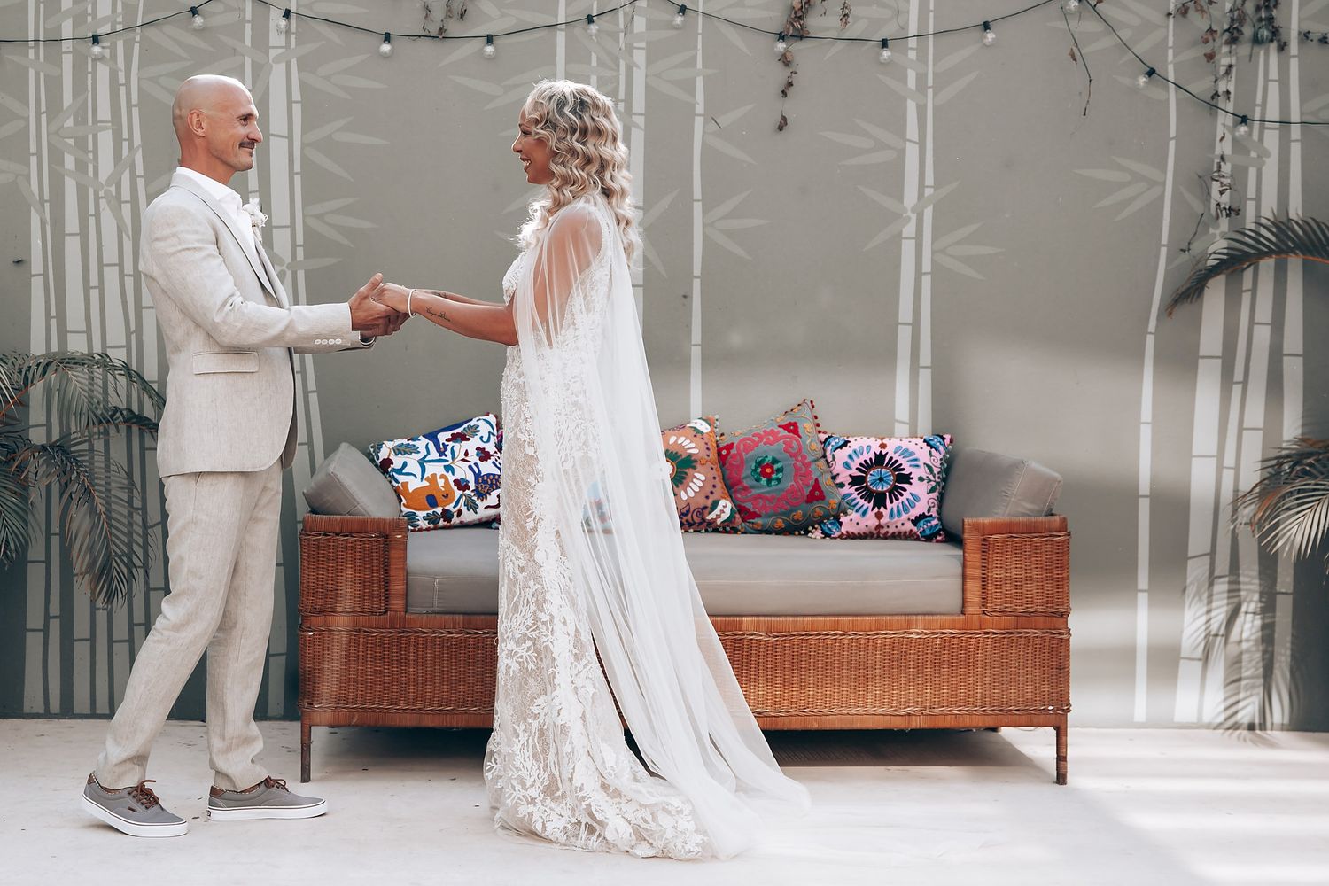 Elegant wedding moment captured in a light-filled interior space.