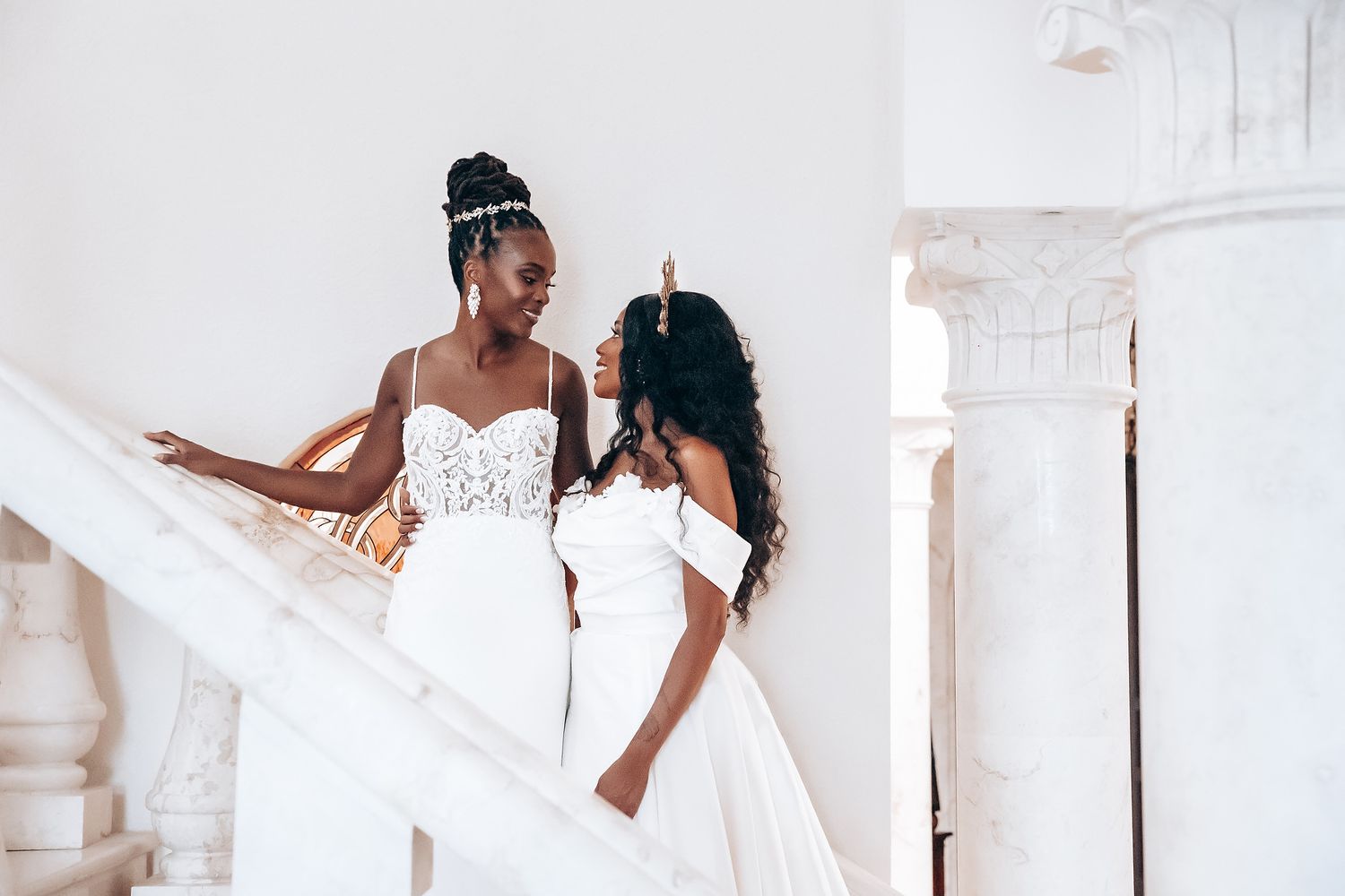 Elegant white wedding dress details captured against a bright interior setting.