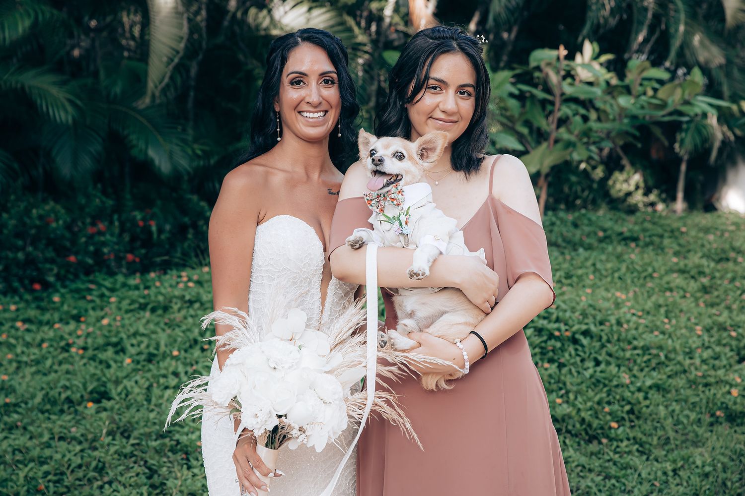 Wedding celebration in a lush garden setting with floral decorations.