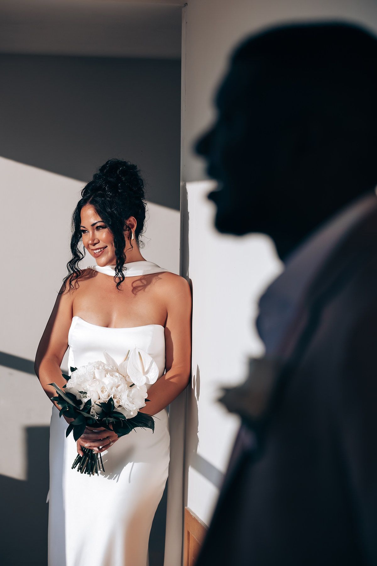 A series of artistic bridal portraits showing a woman in a white wedding dress against dramatic lighting and shadows.