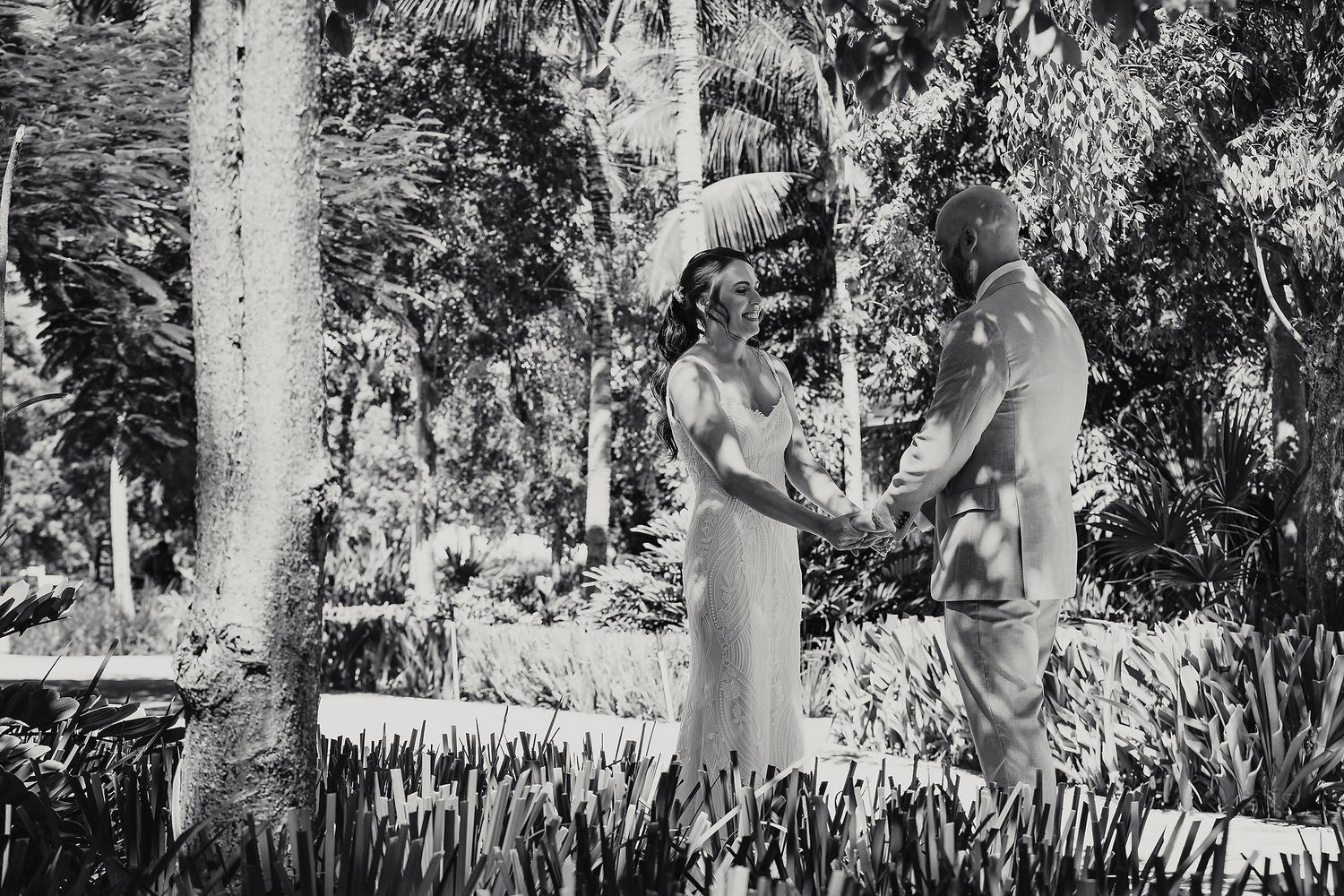 Black and white photo strip showing intimate wedding moments in a garden setting with trees and natural light.