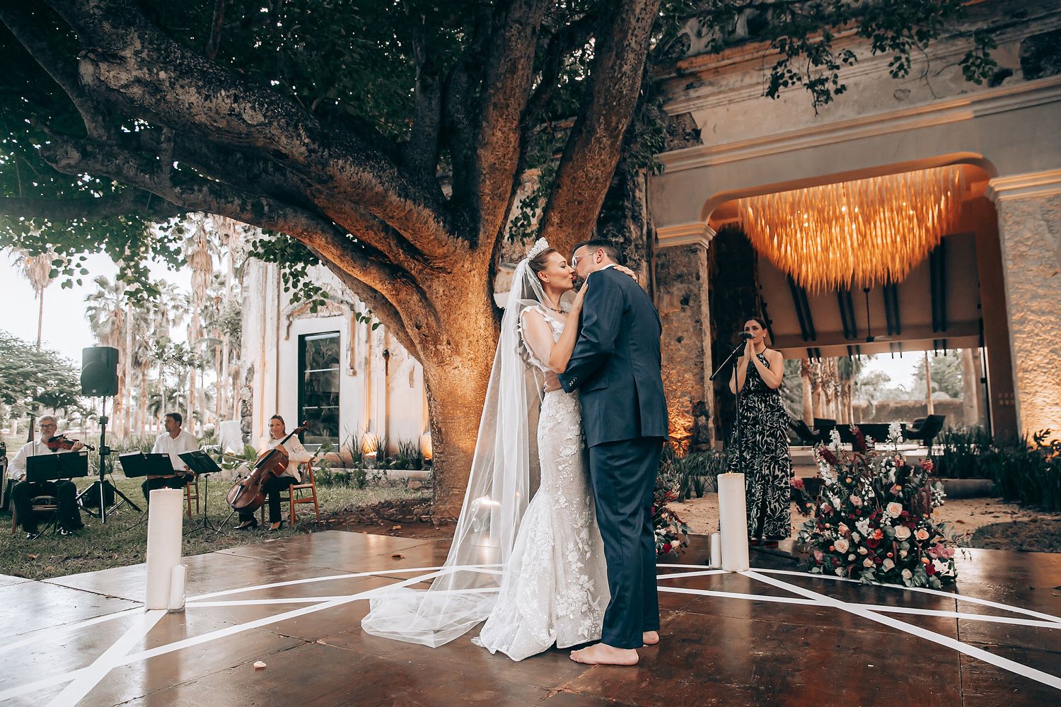 Wedding reception venue with elegant lighting and decor showing multiple dance moments.