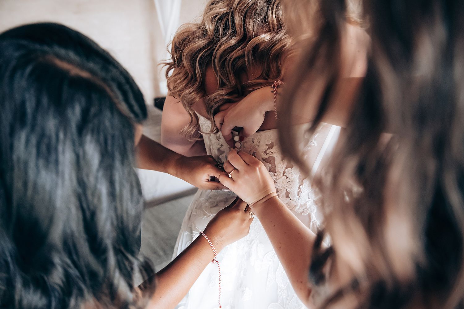 Close-up shots showing intimate moments during wedding preparations.