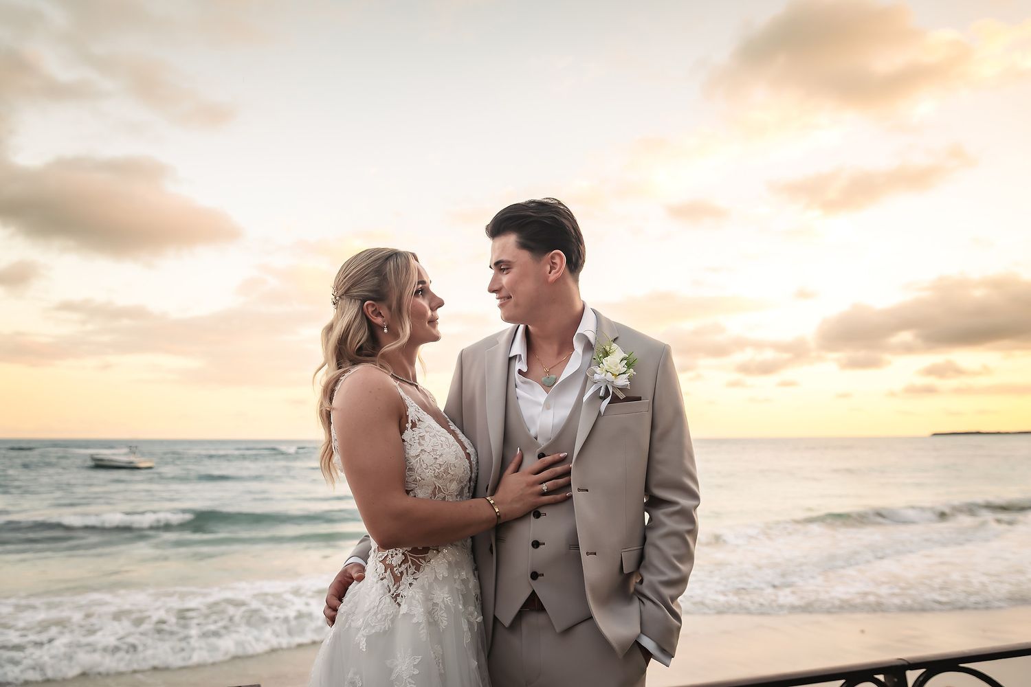 Romantic sunset beach portraits with ocean waves and warm golden lighting.