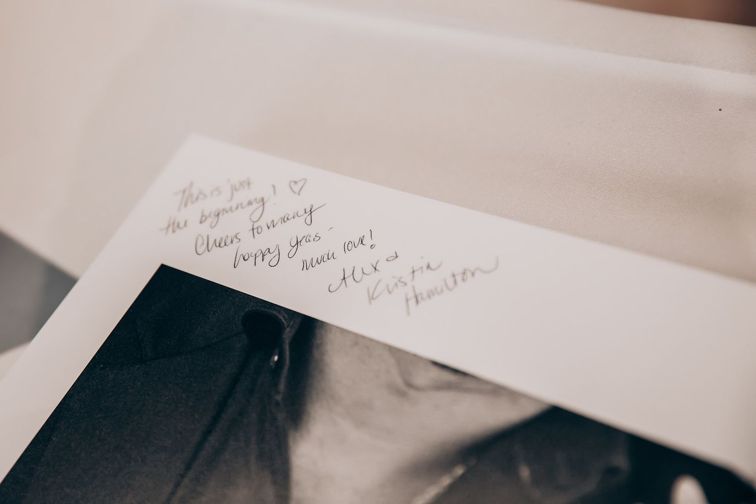 Close-up of handwritten notes in a wedding guest book.