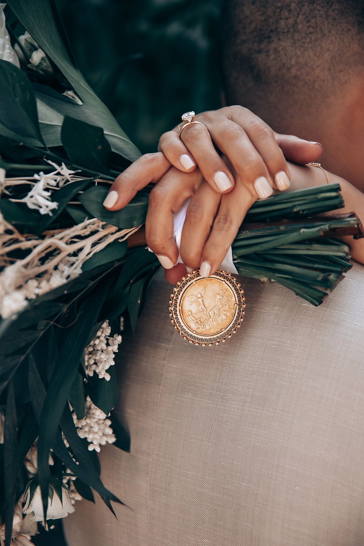 Close-up shots of hands holding decorative round objects with glittery surfaces.