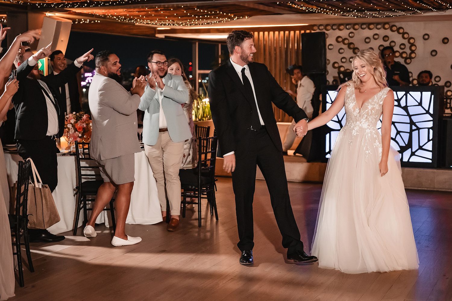 Wedding reception dance floor scenes with guests celebrating under warm lighting.