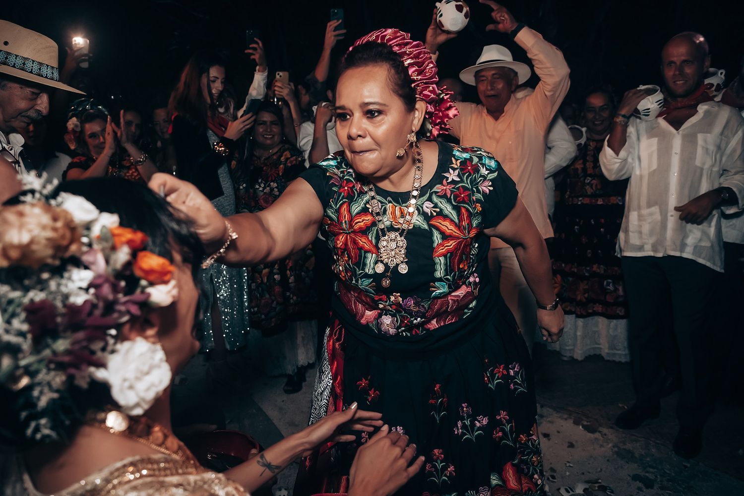 Lively dance floor moments captured during an evening wedding reception celebration.