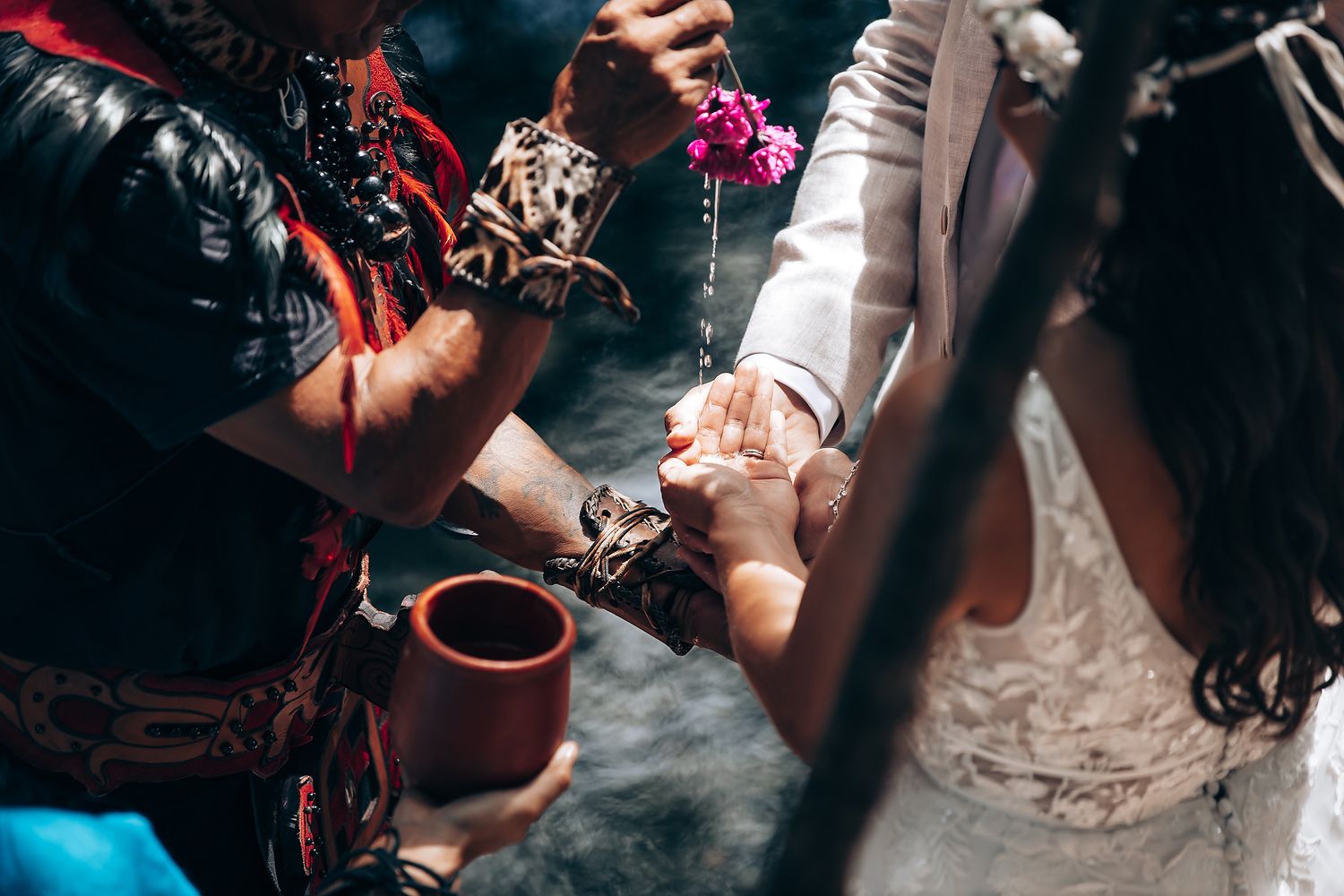 Atmospheric dark shots of a traditional ceremony with ritual elements and fire.