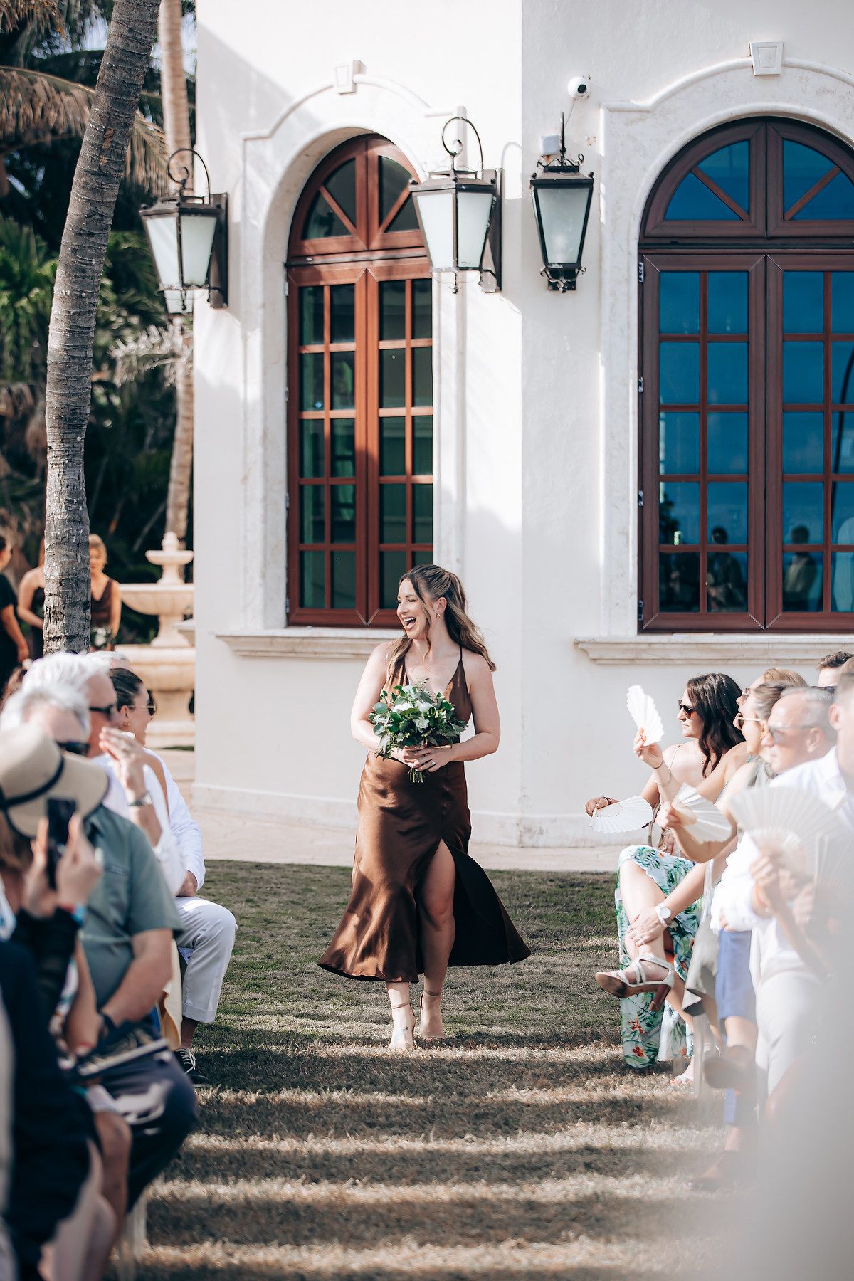A sequence of candid outdoor shots showing people playing and dancing in front of a white building with arched windows.