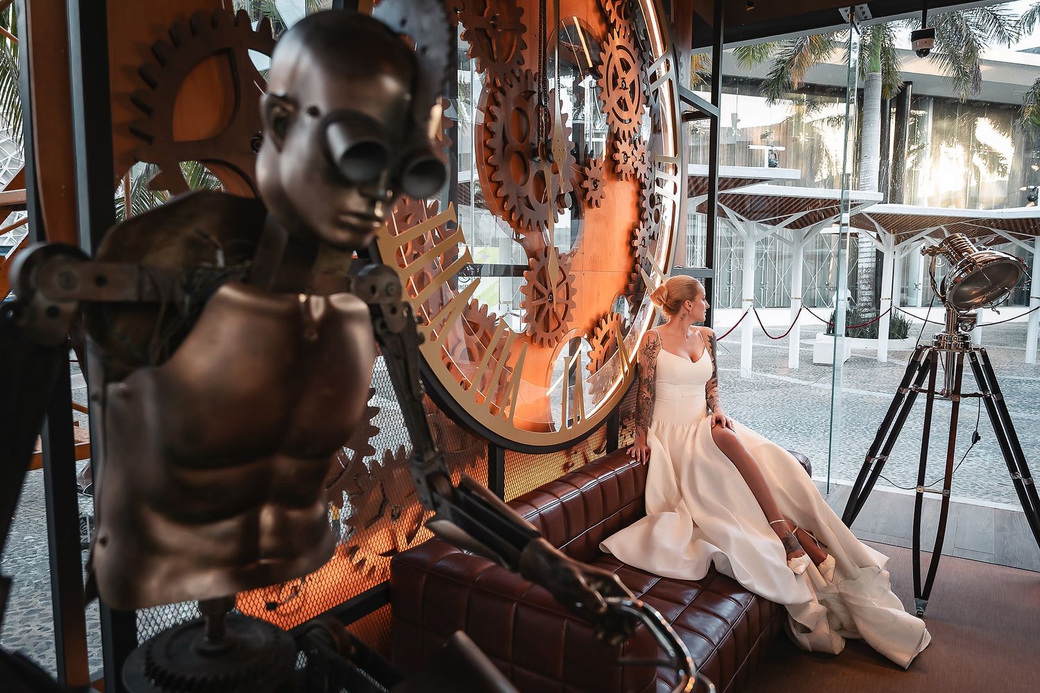 Industrial-style wedding venue with vintage decor and dramatic orange lighting.