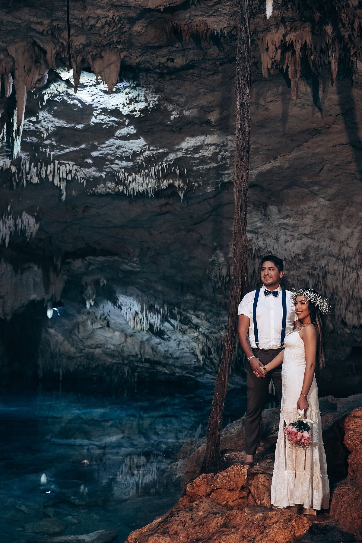 Cenote Taak Bi Ha bride and groom portrait by cenote water