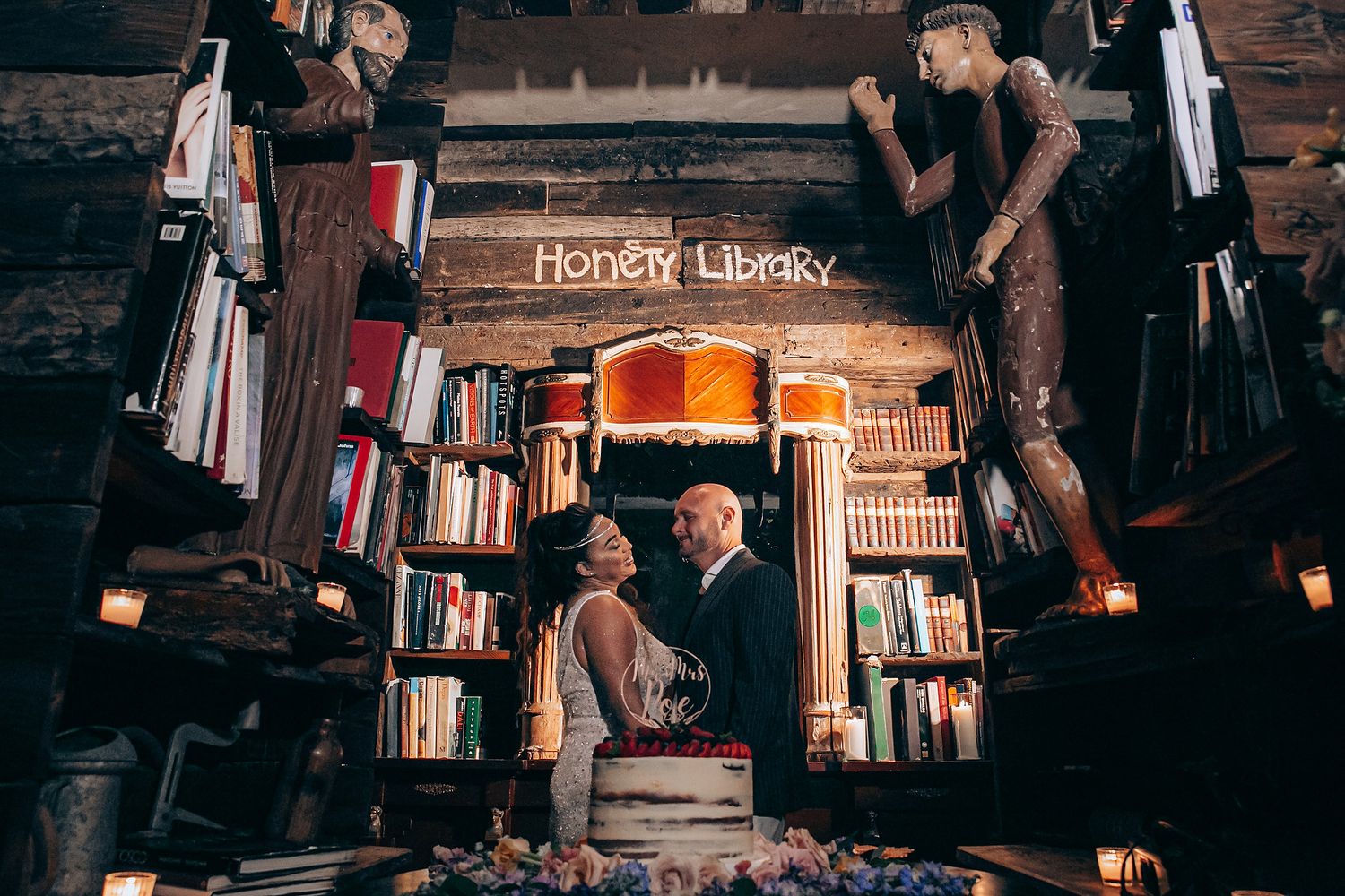 Vintage bookstore interior with wooden shelves filled with books and warm lighting creating a cozy atmosphere.