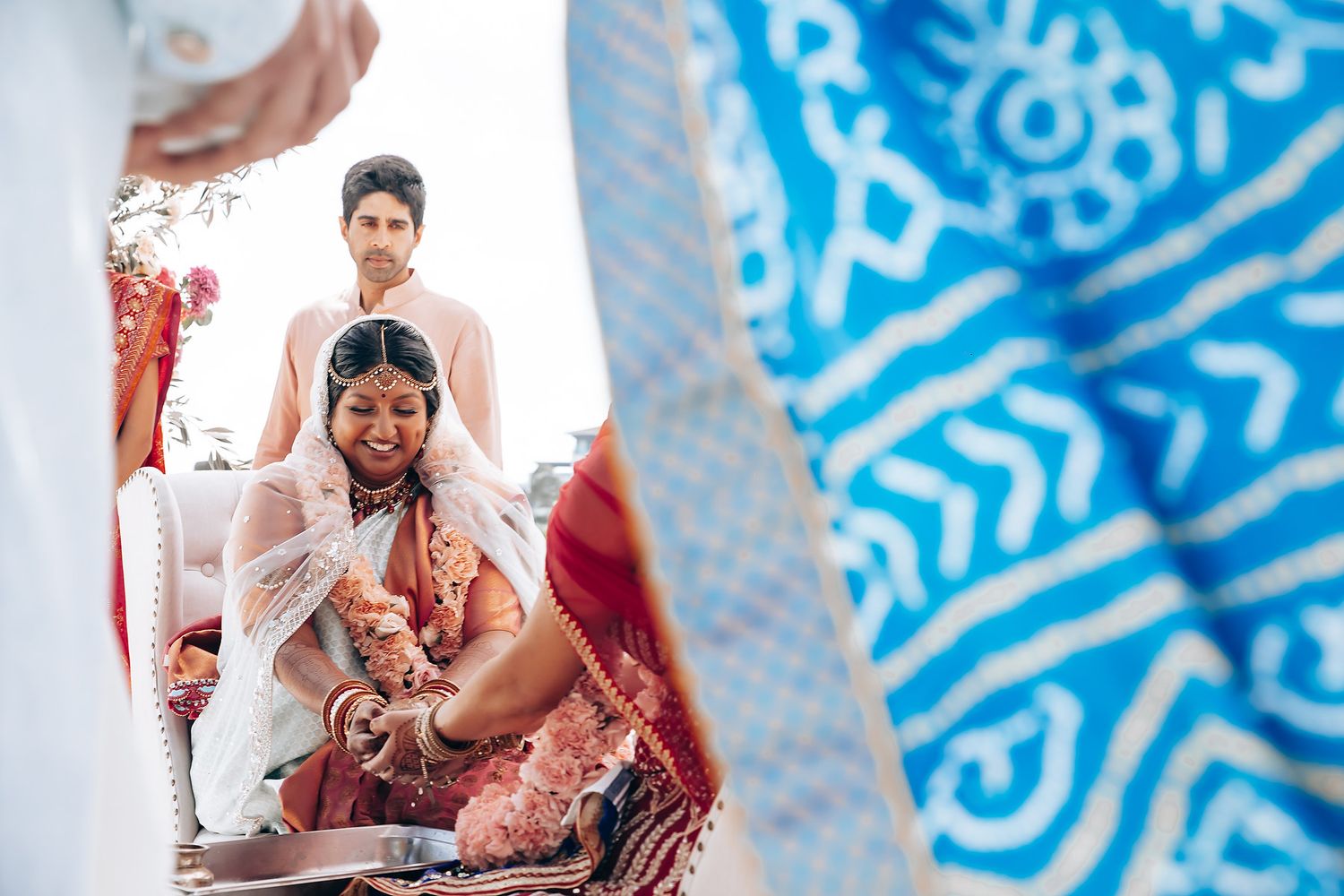 Decorative blue and white patterned backdrop at an outdoor wedding venue.