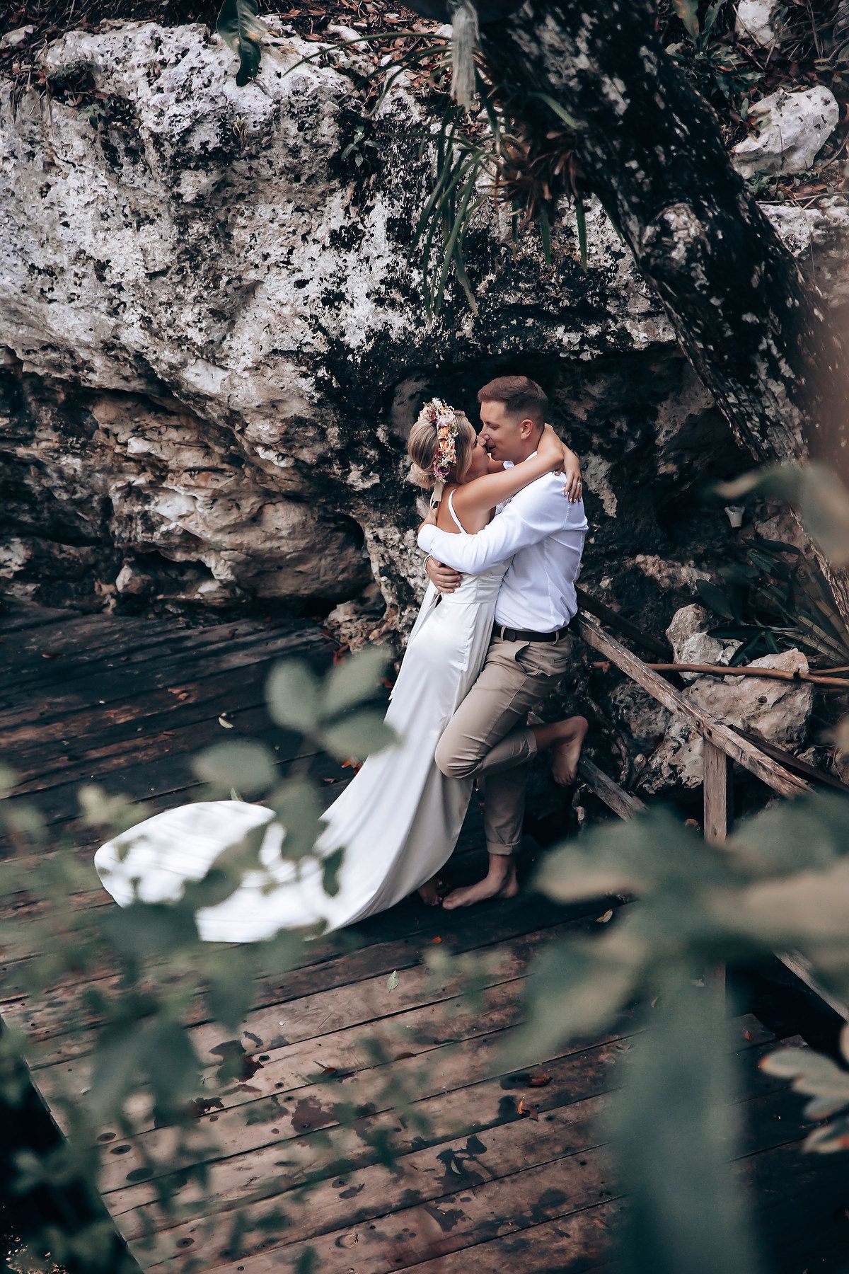 Romantic woodland scene with decorative setup against natural cave backdrop.