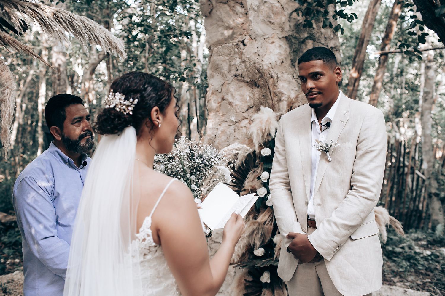 Intimate moments captured during a woodland wedding ceremony.