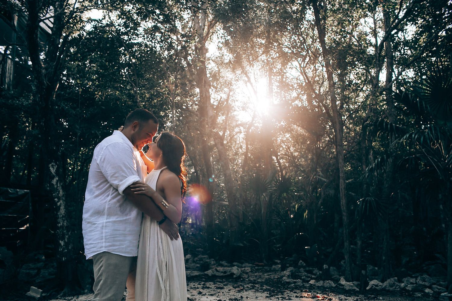 Sunset ceremony in forest setting with golden light filtering through trees.