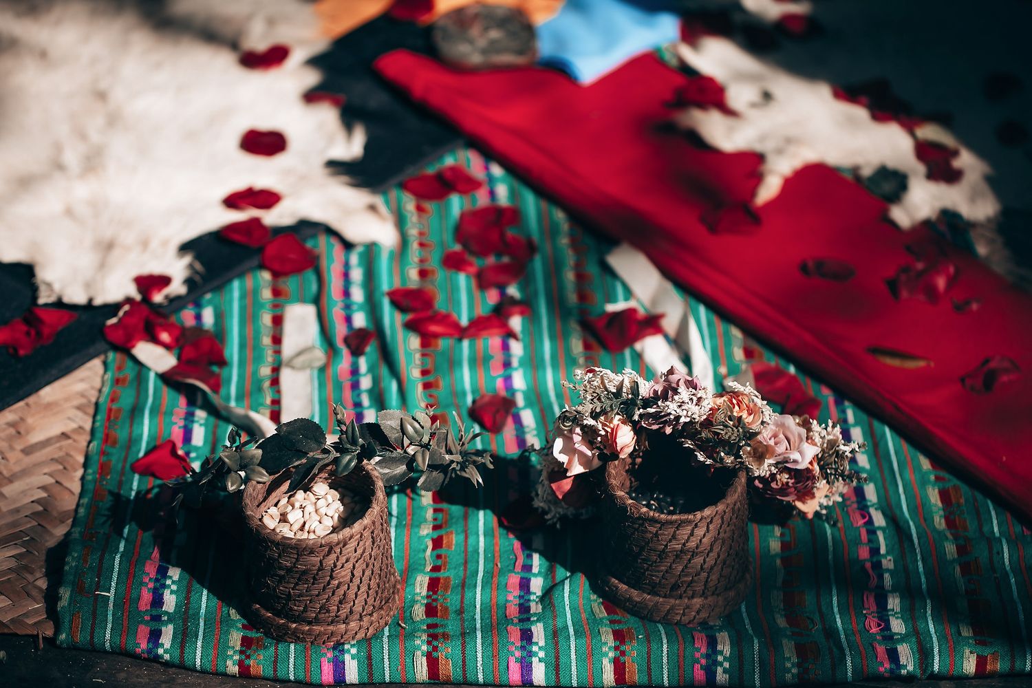 Chocolate cupcakes with red cherries and whipped cream frosting arranged on a teal vintage-style surface.