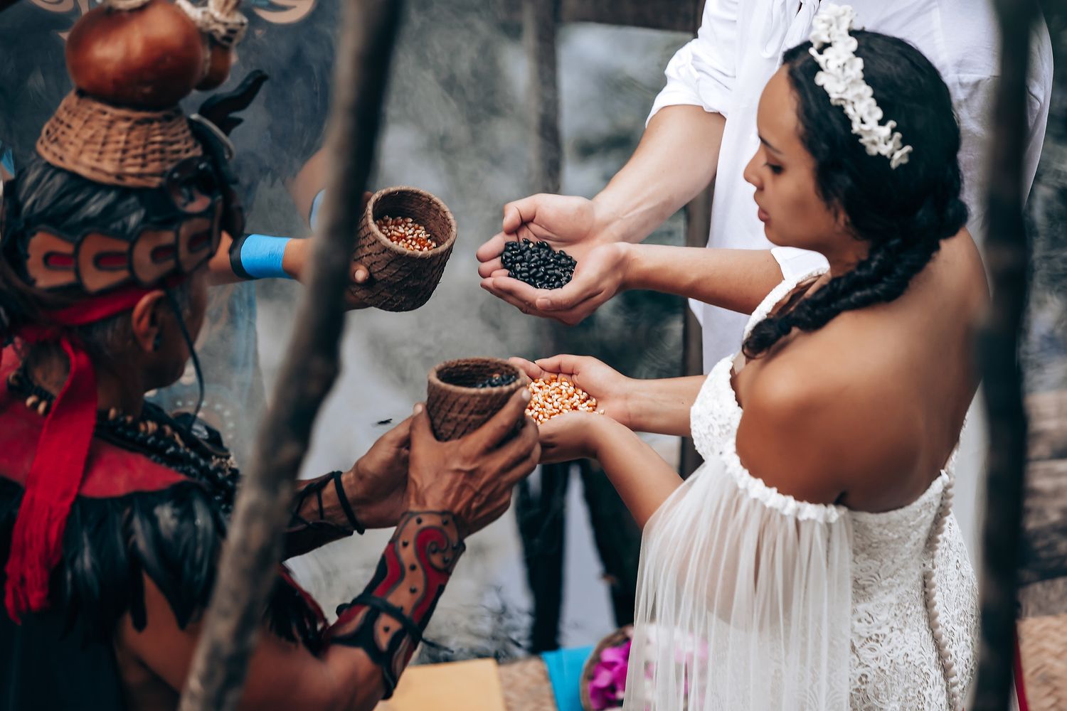 Traditional Turkish coffee ceremony with ornate copper cezve pots and white dress during cultural celebration.