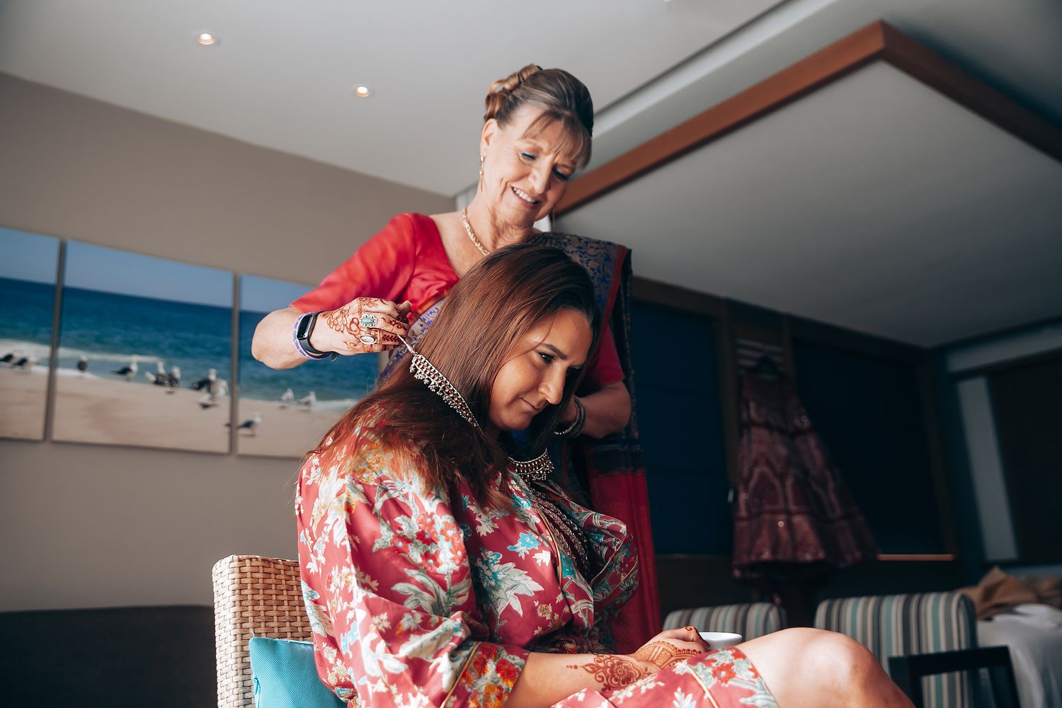 Preparation moments during an Indian wedding ceremony with traditional attire.