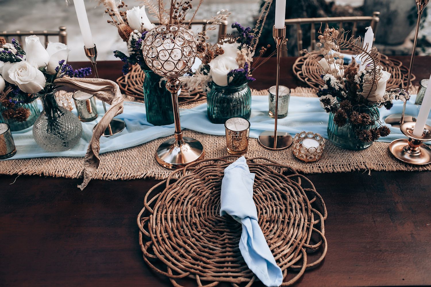 Rustic woven baskets arranged on a wooden surface with decorative elements.