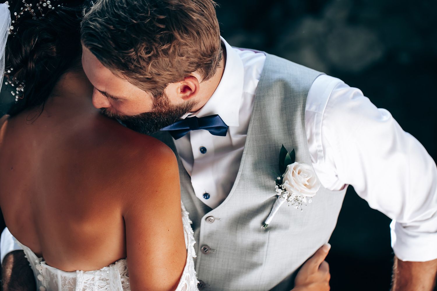 Intimate wedding couple moment captured in artistic black and white photography.