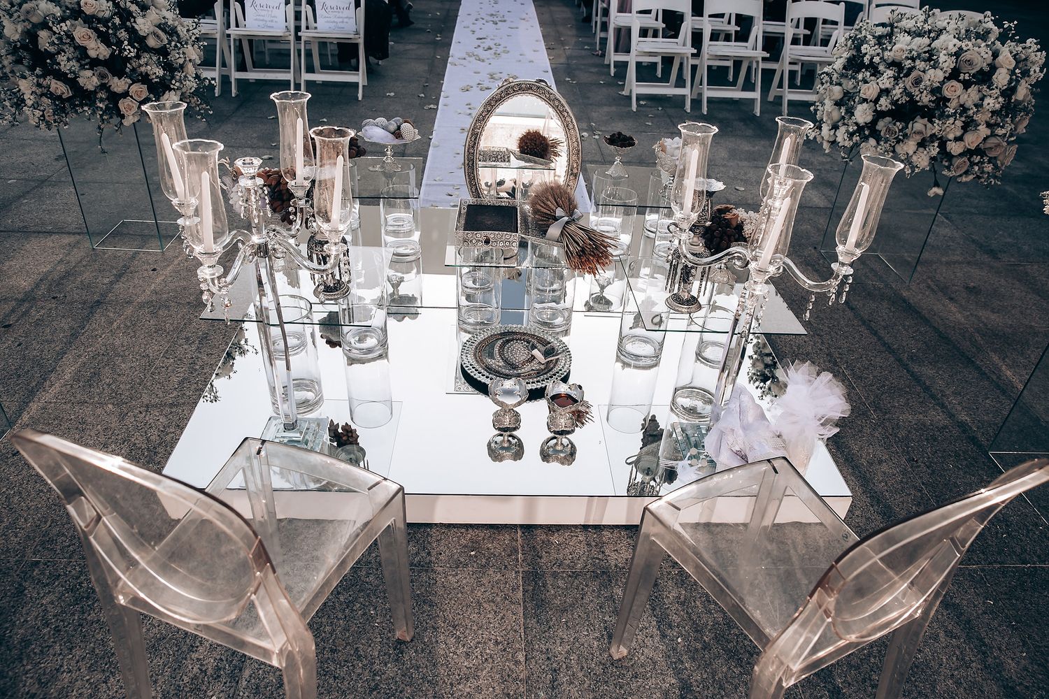 Laboratory glassware and scientific equipment arranged on a table for chemical experiments and research.