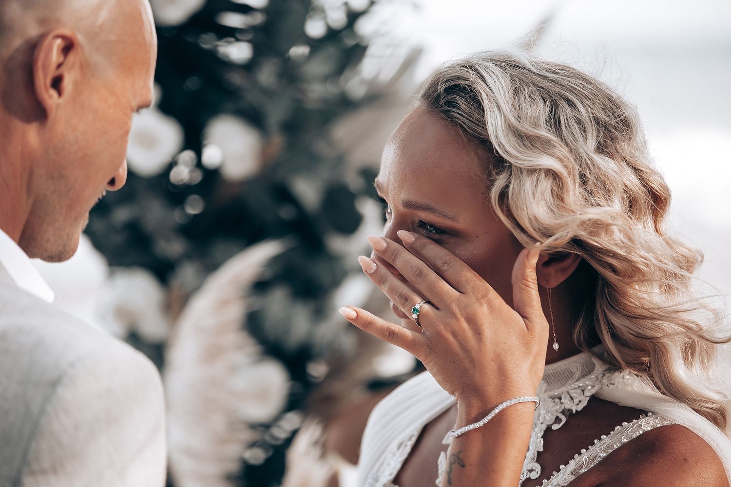 A candid moment showing wedding preparations with elegant dresses and accessories.