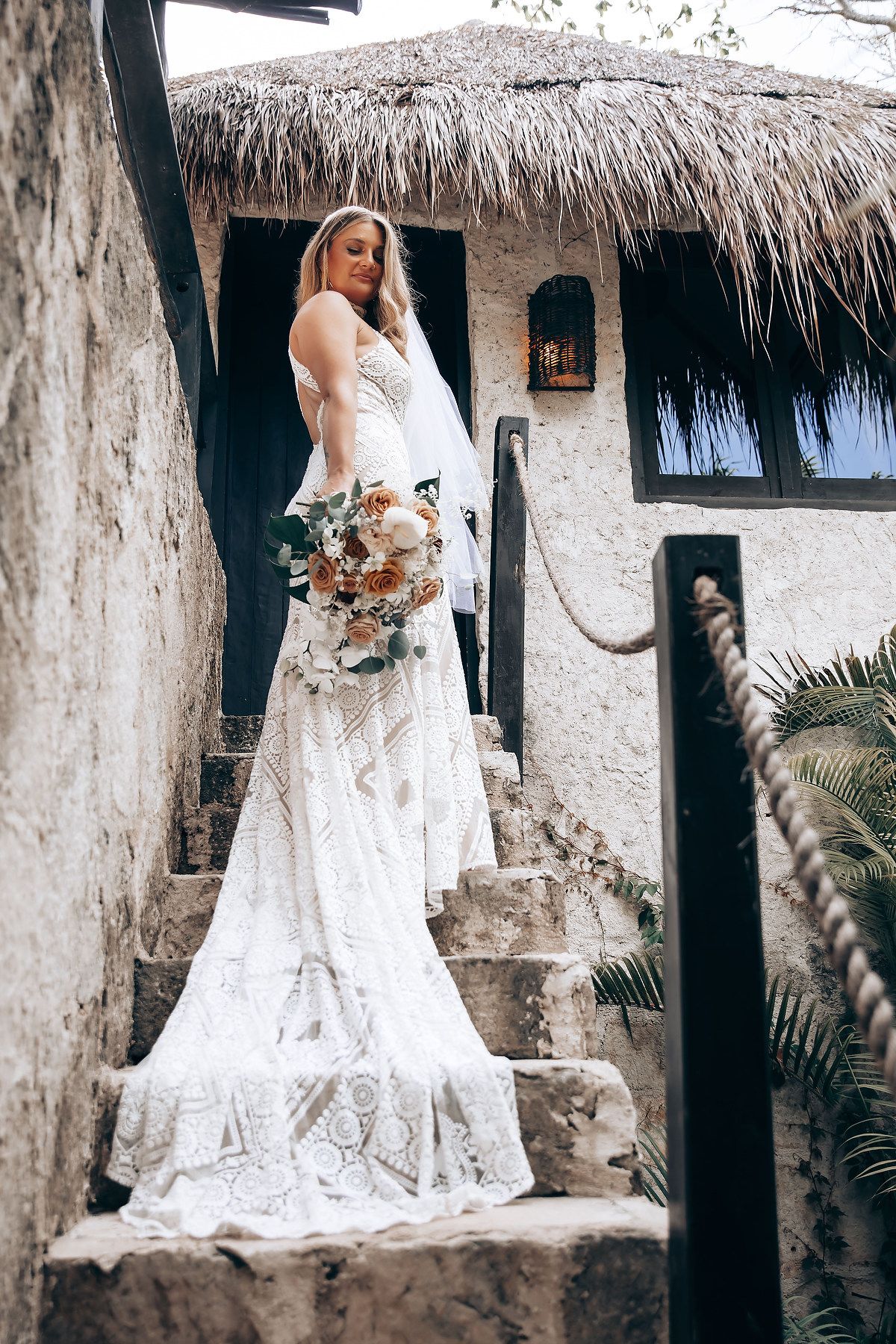 Beautiful lace wedding dress captured in multiple angles against a rustic tropical backdrop.