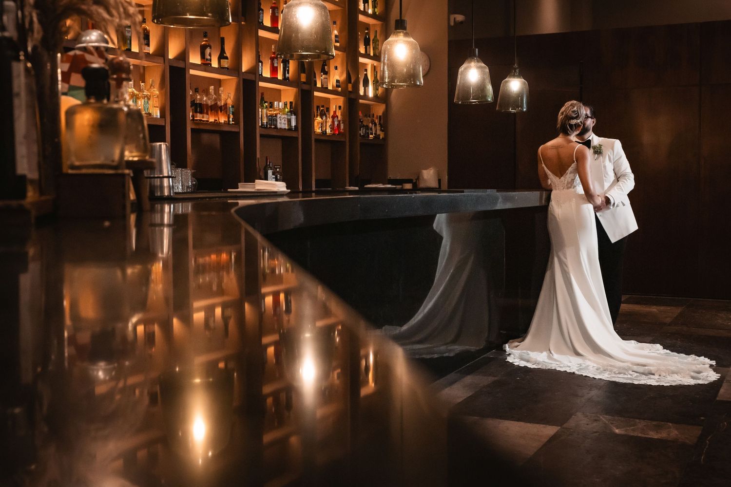 Moody bar interior with warm lighting and elegant decor creating an intimate atmosphere.