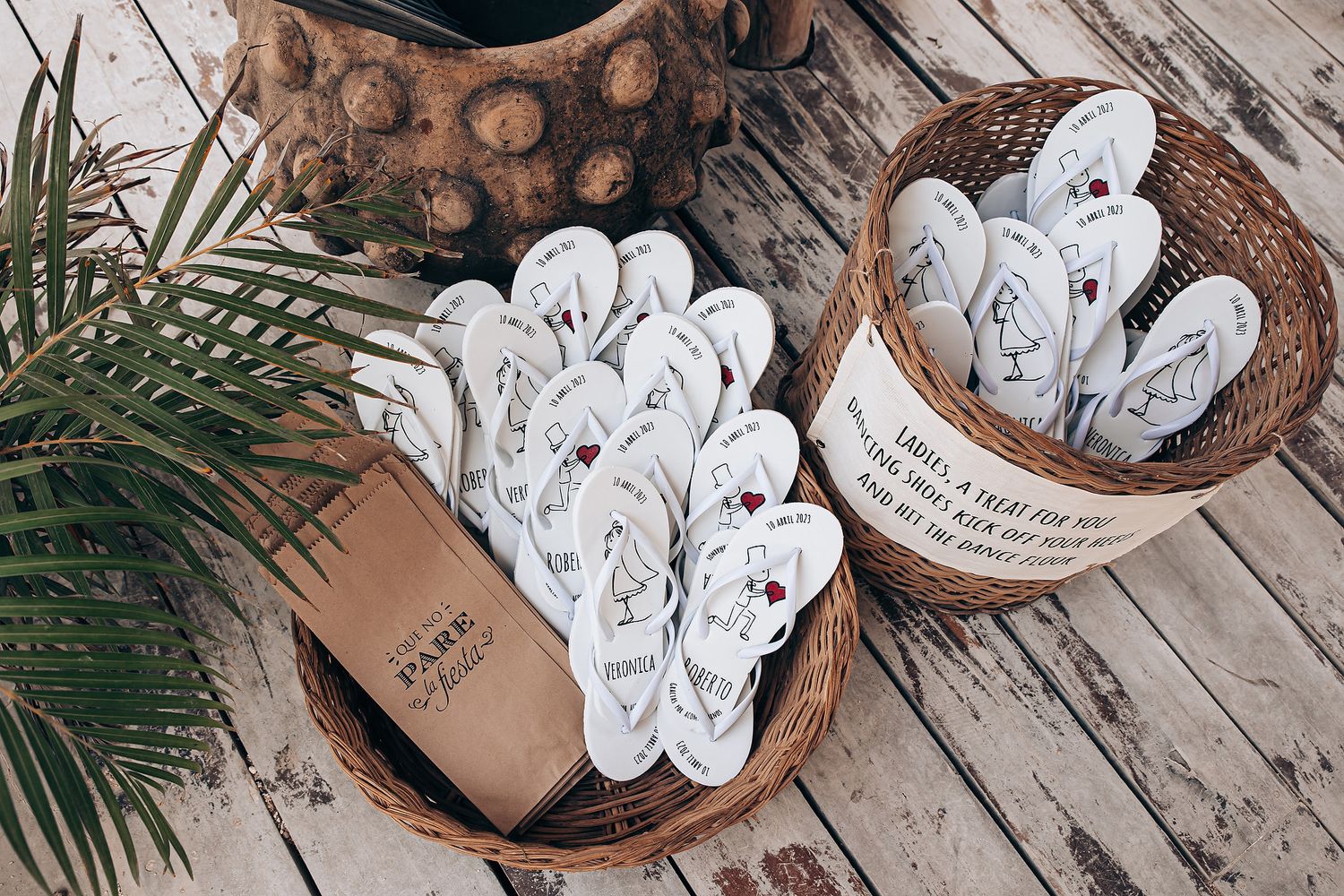 Rustic wooden ornaments with handwritten messages displayed on weathered wood planks with pine greenery accents.